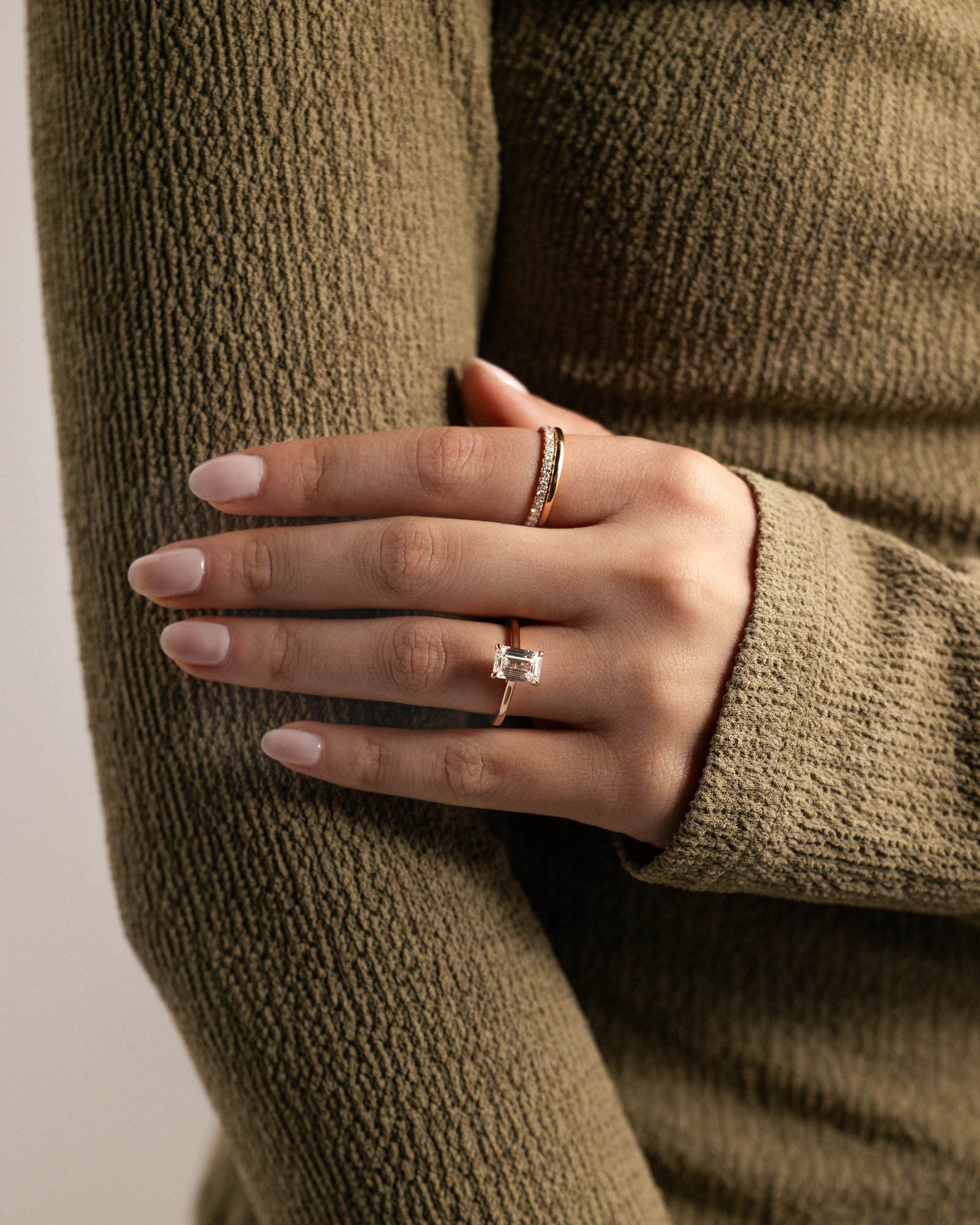 Jane - Emerald Solitaire with Hidden Halo and Cathedral Setting Lifestyle Image