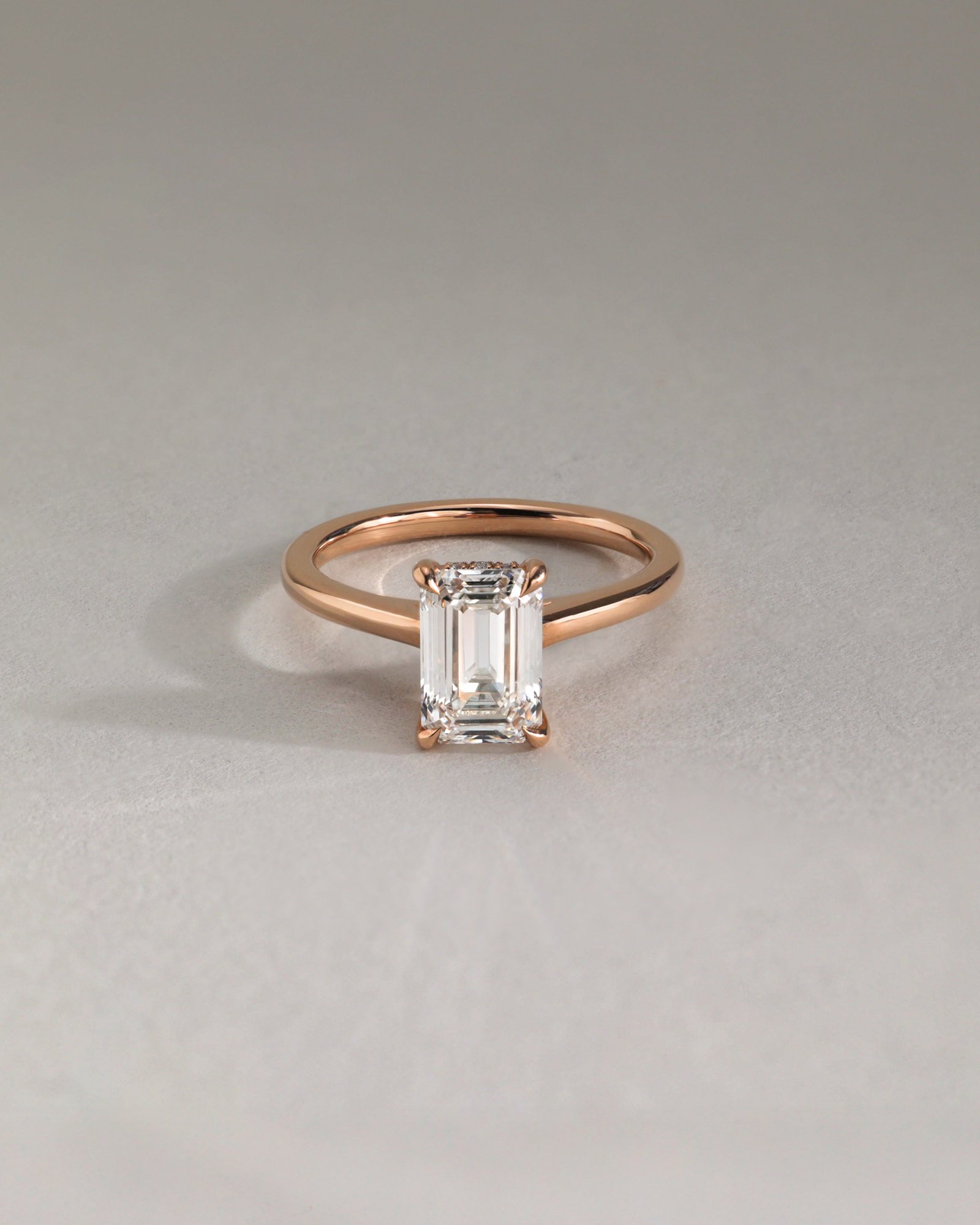 Jane - Emerald Solitaire with Hidden Halo and Cathedral Setting Lifestyle Image