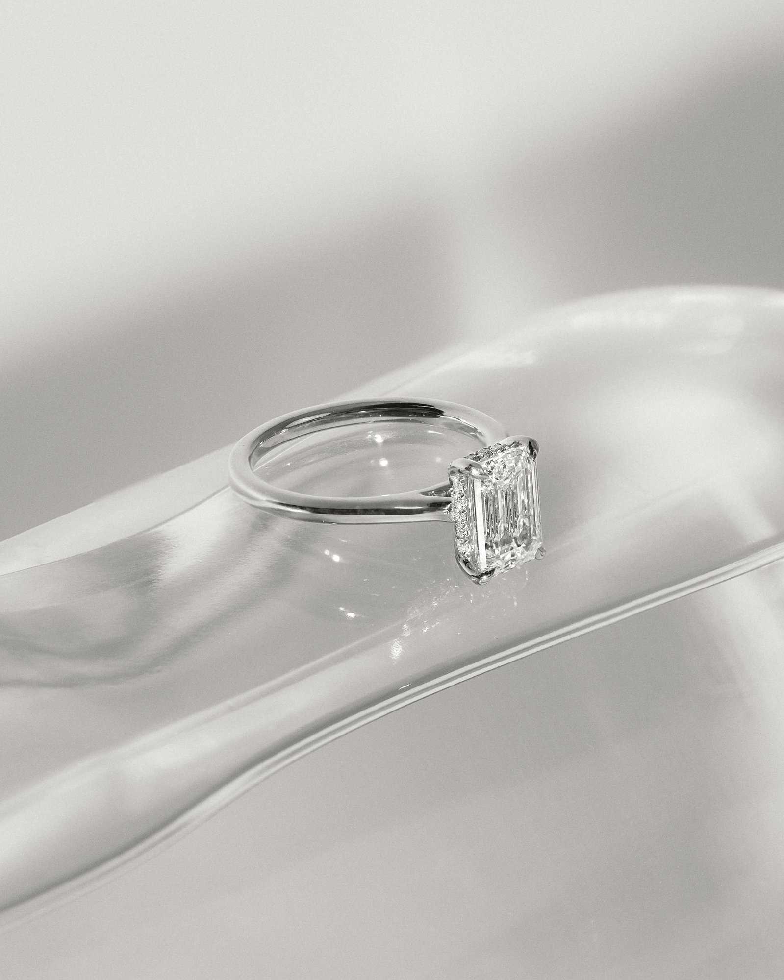 Jane - Emerald Solitaire with Hidden Halo and Cathedral Setting Lifestyle Image