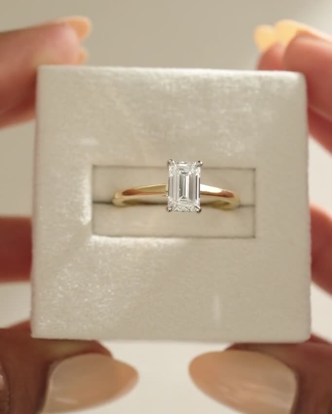 Jane - Emerald Solitaire with Hidden Halo and Cathedral Setting Lifestyle Image