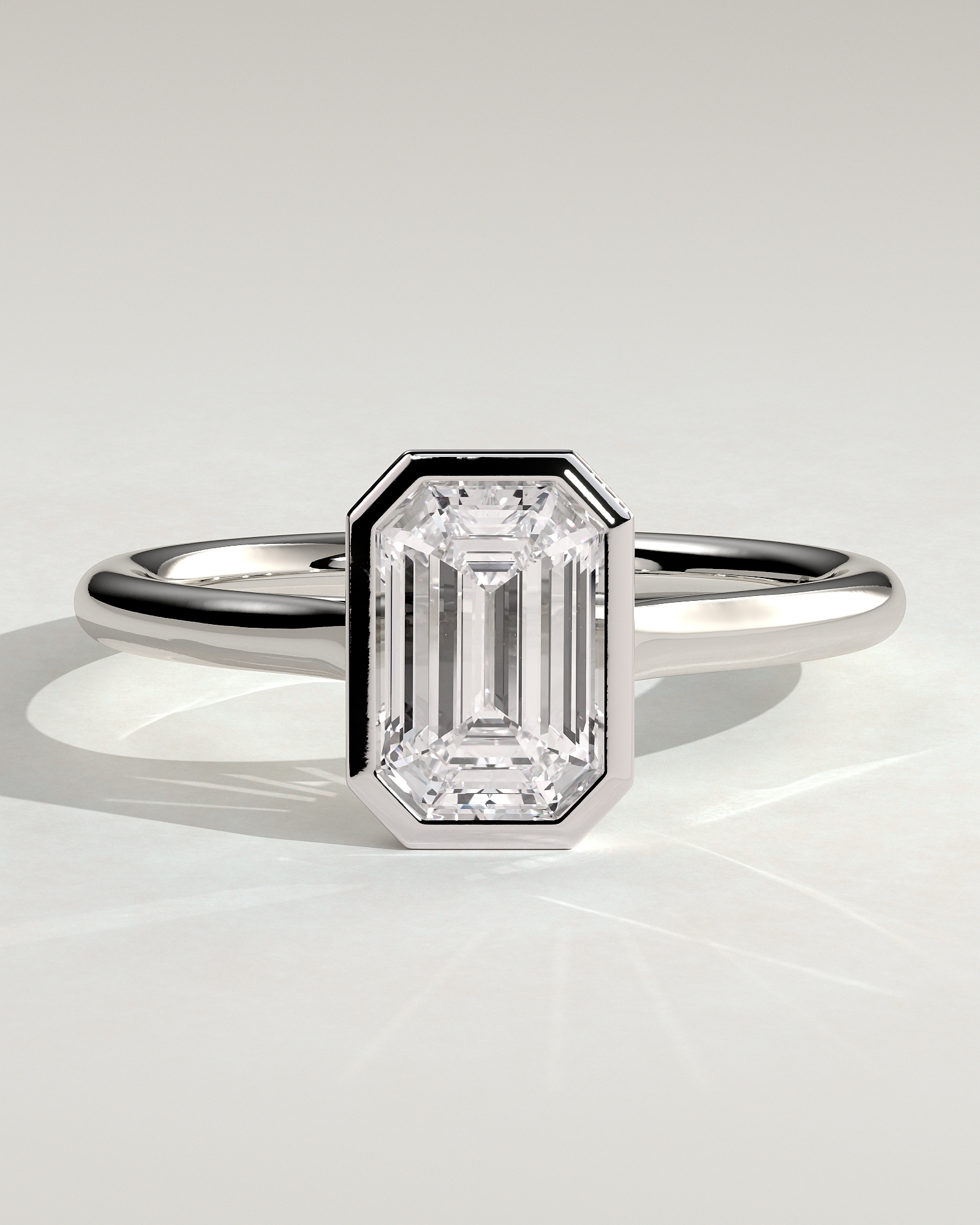 Journee - Bezel Set Emerald Solitaire - 18k White Gold