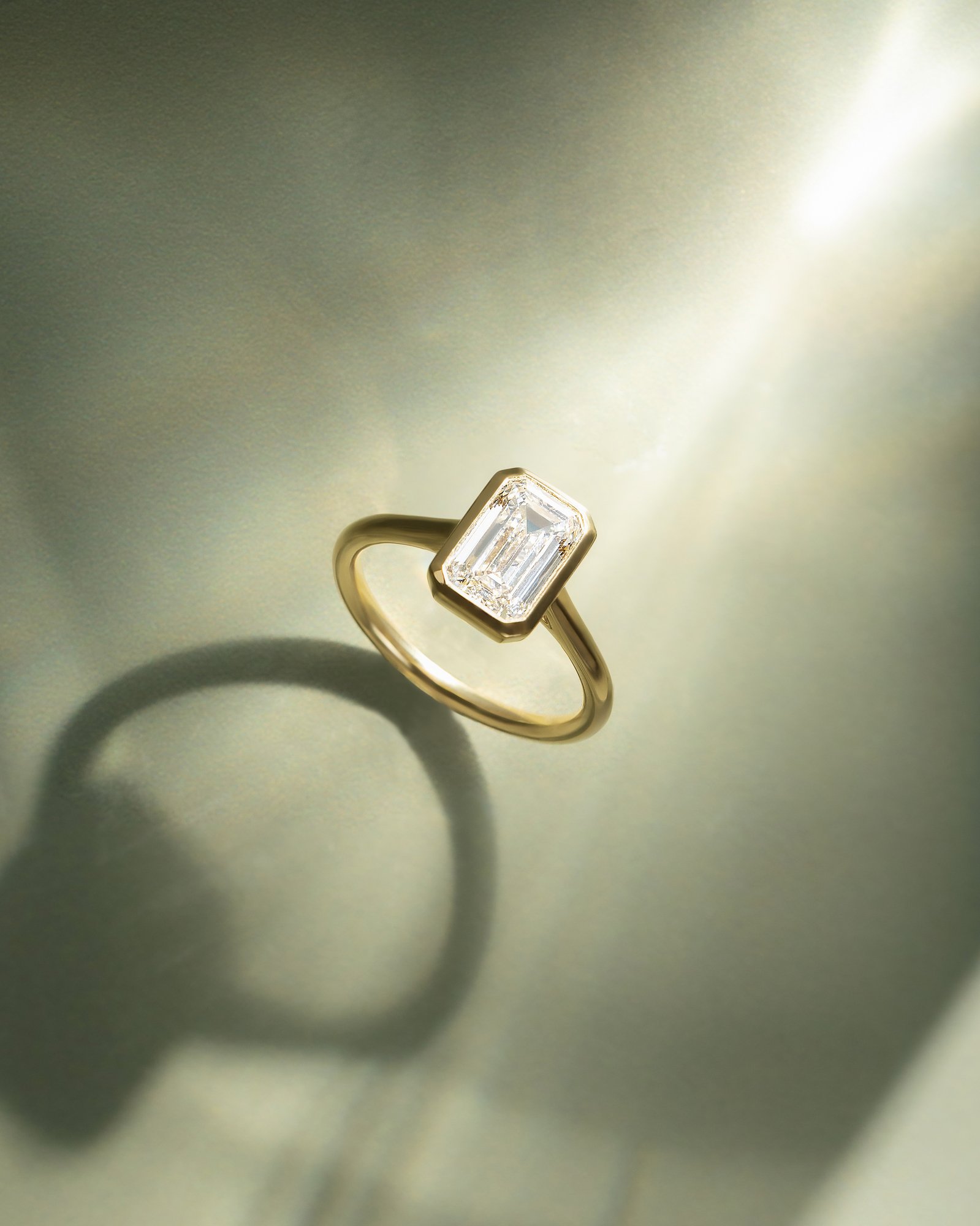 Journee - Bezel Set Emerald Solitaire Lifestyle Image