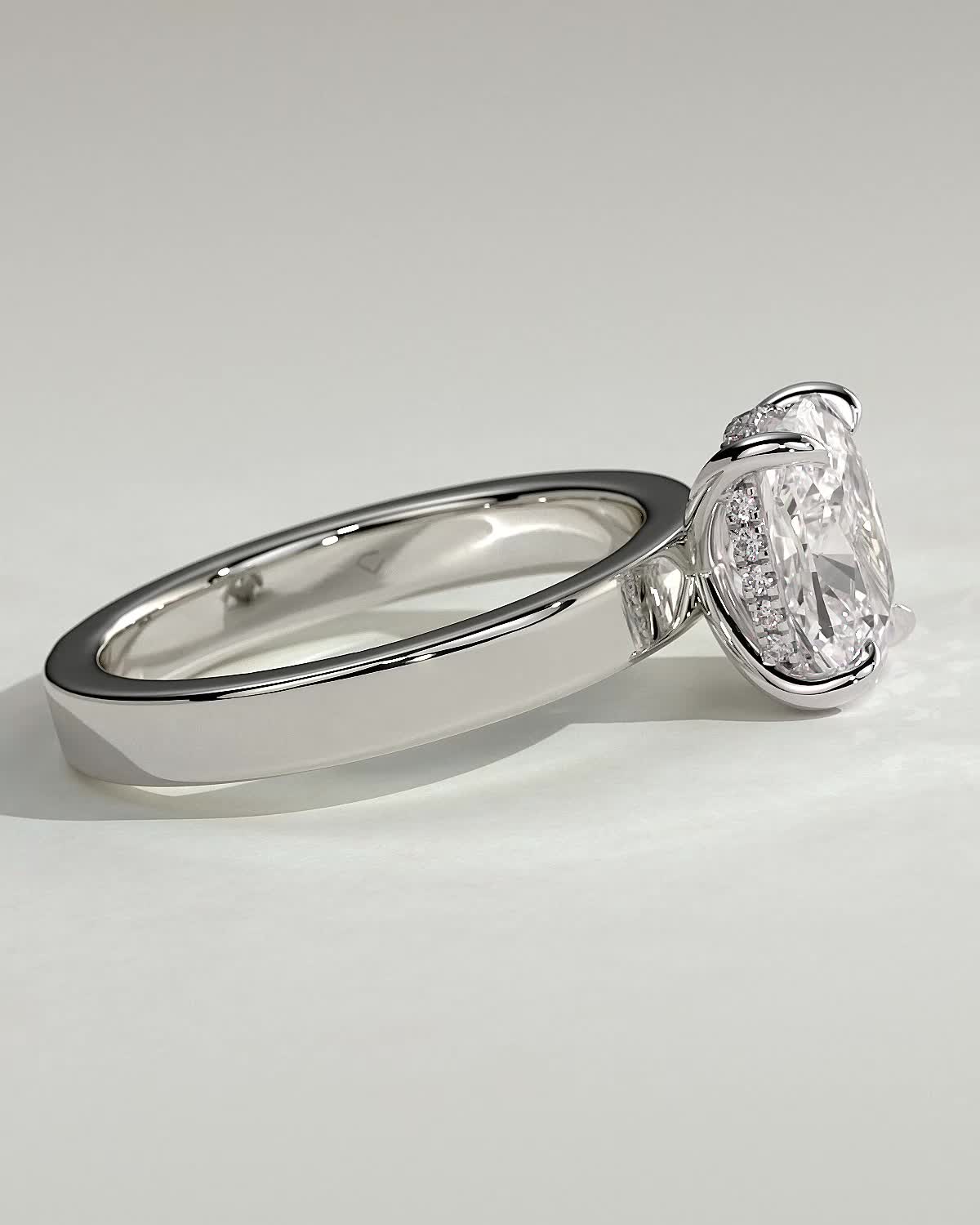Kai - Elongated Cushion 4 Claw Solitaire with Flat Cigar Band and Hidden Halo Engagement Ring - 18k White Gold High Setting