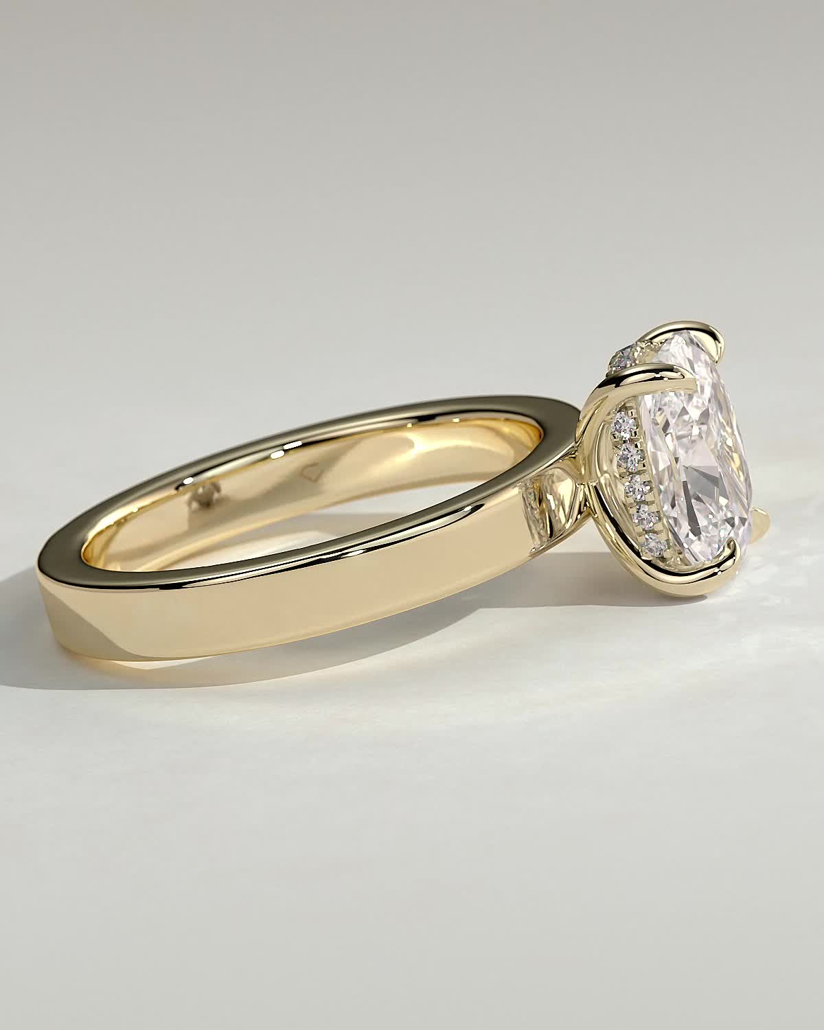 Kai - Elongated Cushion 4 Claw Solitaire with Flat Cigar Band and Hidden Halo Engagement Ring - 18k Yellow Gold High Setting