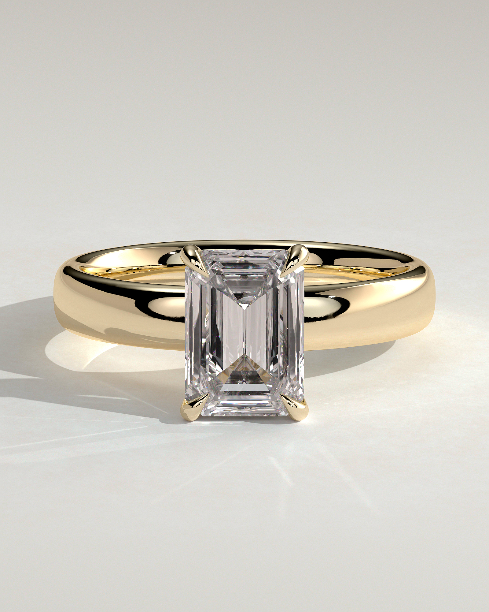 Kate - Emerald Solitaire with Cigar Band - 18k Yellow Gold High Setting