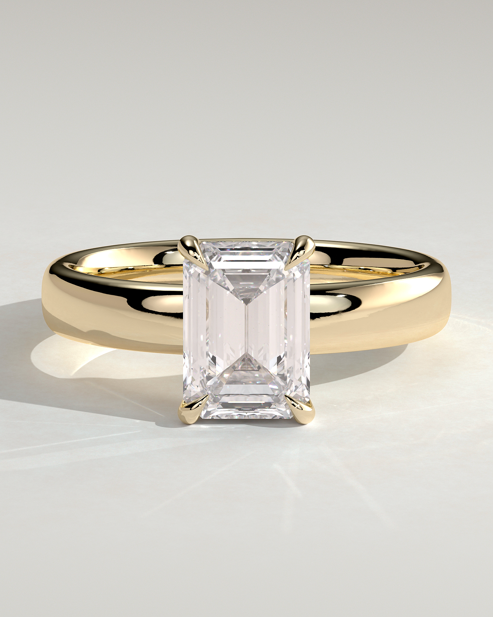 Kate - Emerald Solitaire with Cigar Band - 18k Yellow Gold Low Setting