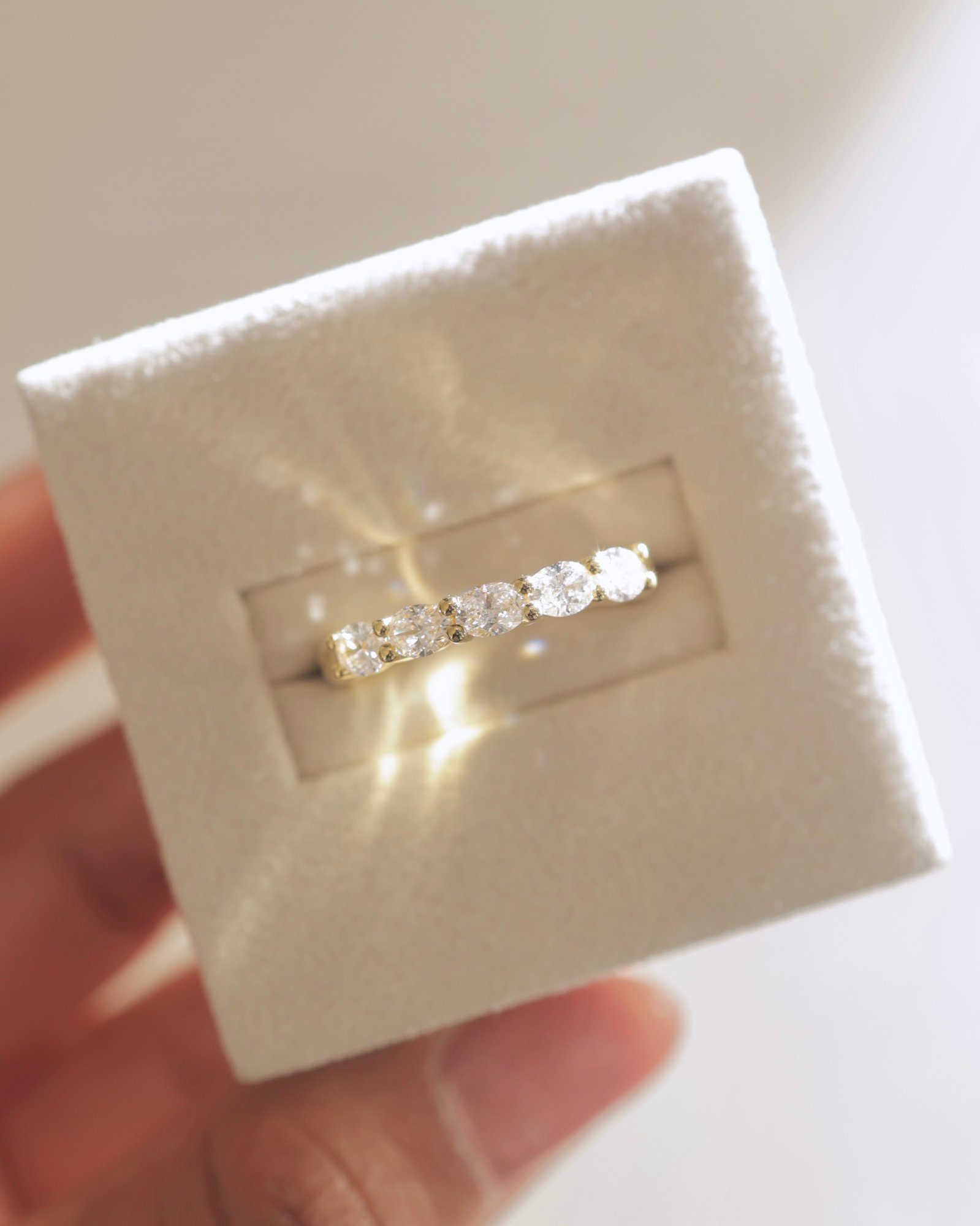 Levi - 5 Stone East West Oval Wedding Band Lifestyle Image