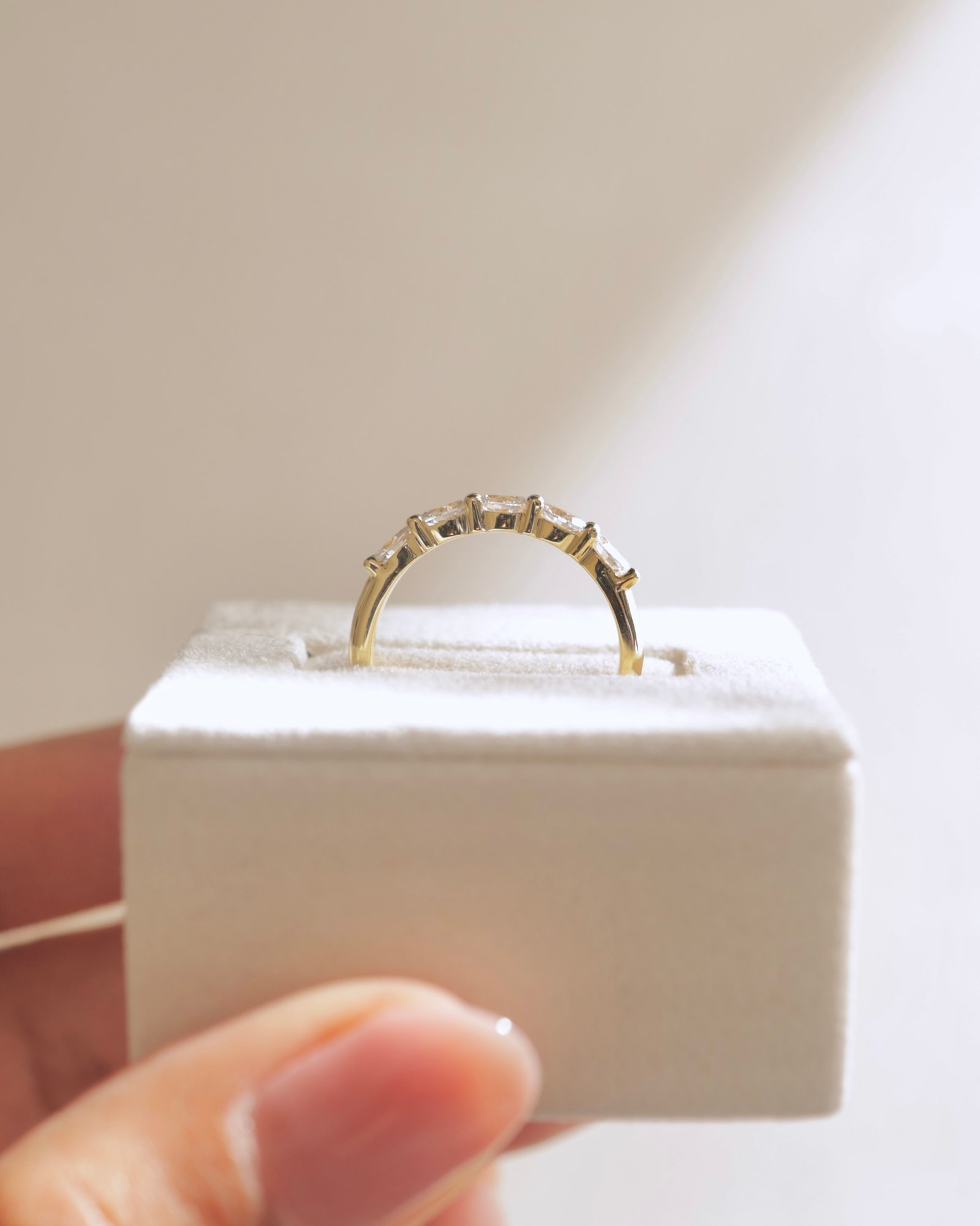 Levi - 5 Stone East West Oval Wedding Band Lifestyle Image