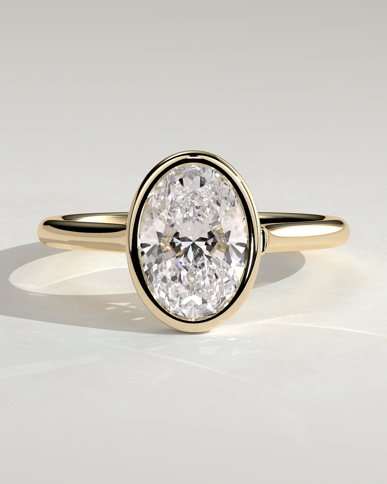 Lexie - Bezel Set Oval with Cathedral Setting - 18k Yellow Gold