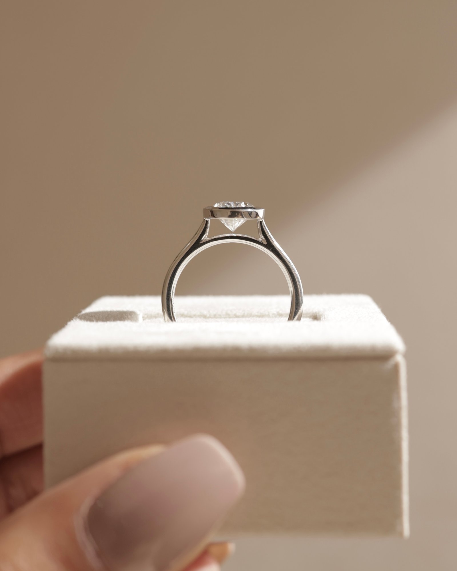 Lexie - Bezel Set Oval with Cathedral Setting Lifestyle Image