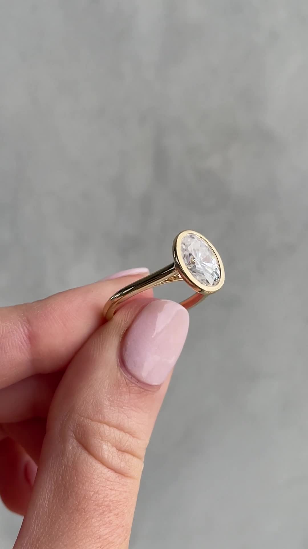 Lexie - Bezel Set Oval with Cathedral Setting Lifestyle Image