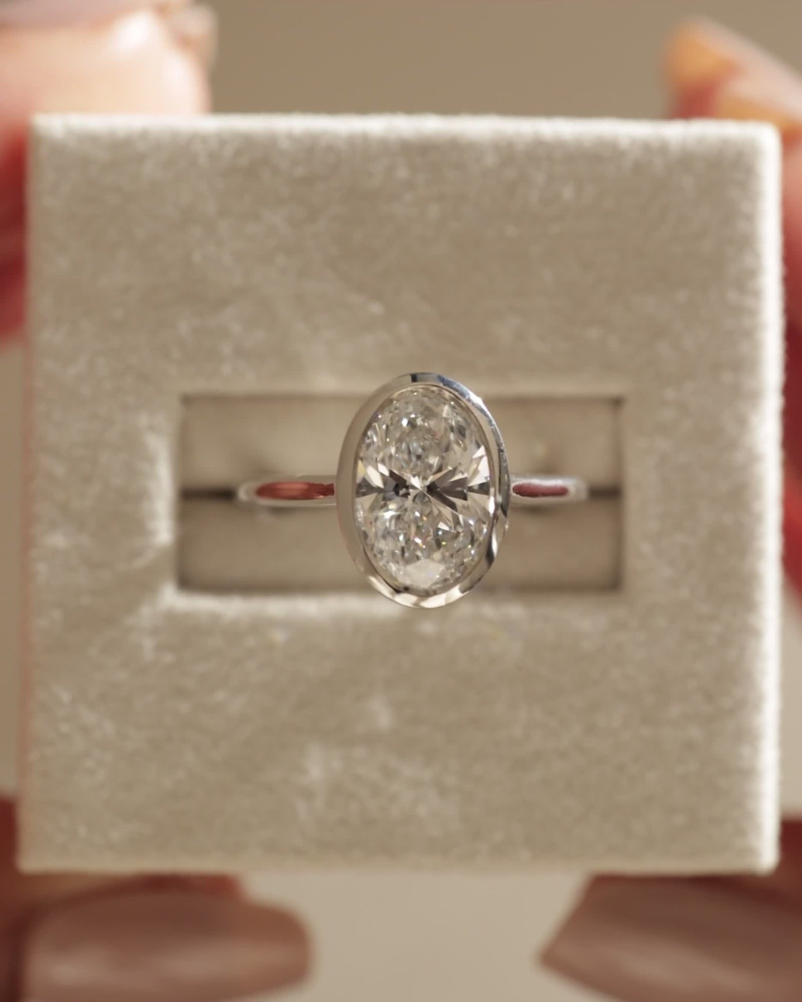 Lexie - Bezel Set Oval with Cathedral Setting Lifestyle Image