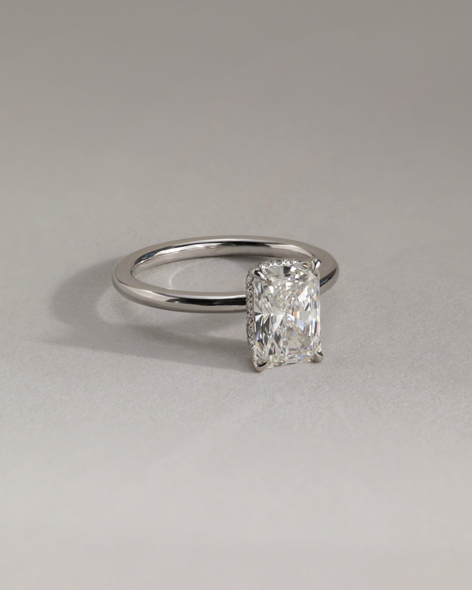 Liberty - Radiant Solitaire with Wrap Around Hidden Halo Lifestyle Image