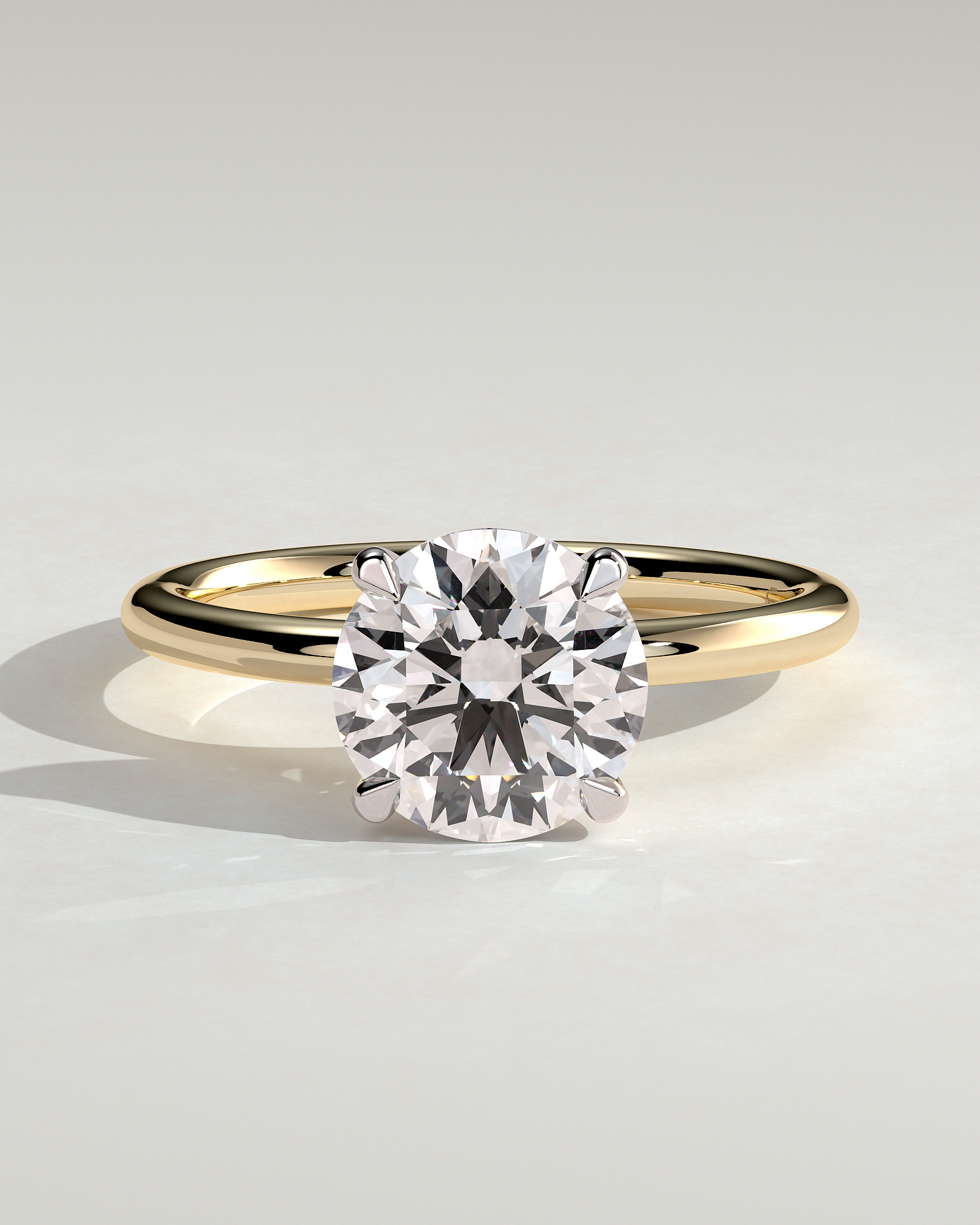 Lilly  4 Claw Round Solitaire - 18k Yellow Gold / 18k White Gold