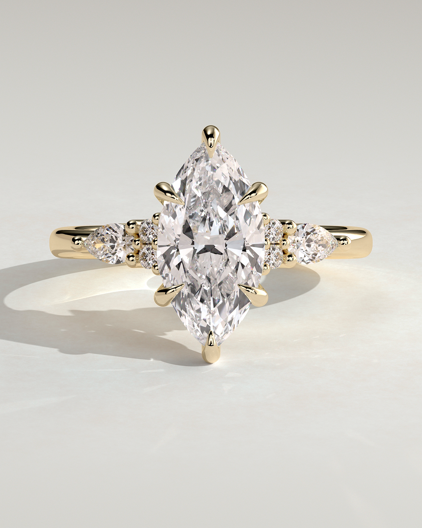 Loretta - Marquise 6 Claw Solitaire with Pear Accents and Round Shoulder Stones Engagement Ring - 18k Yellow Gold High Setting