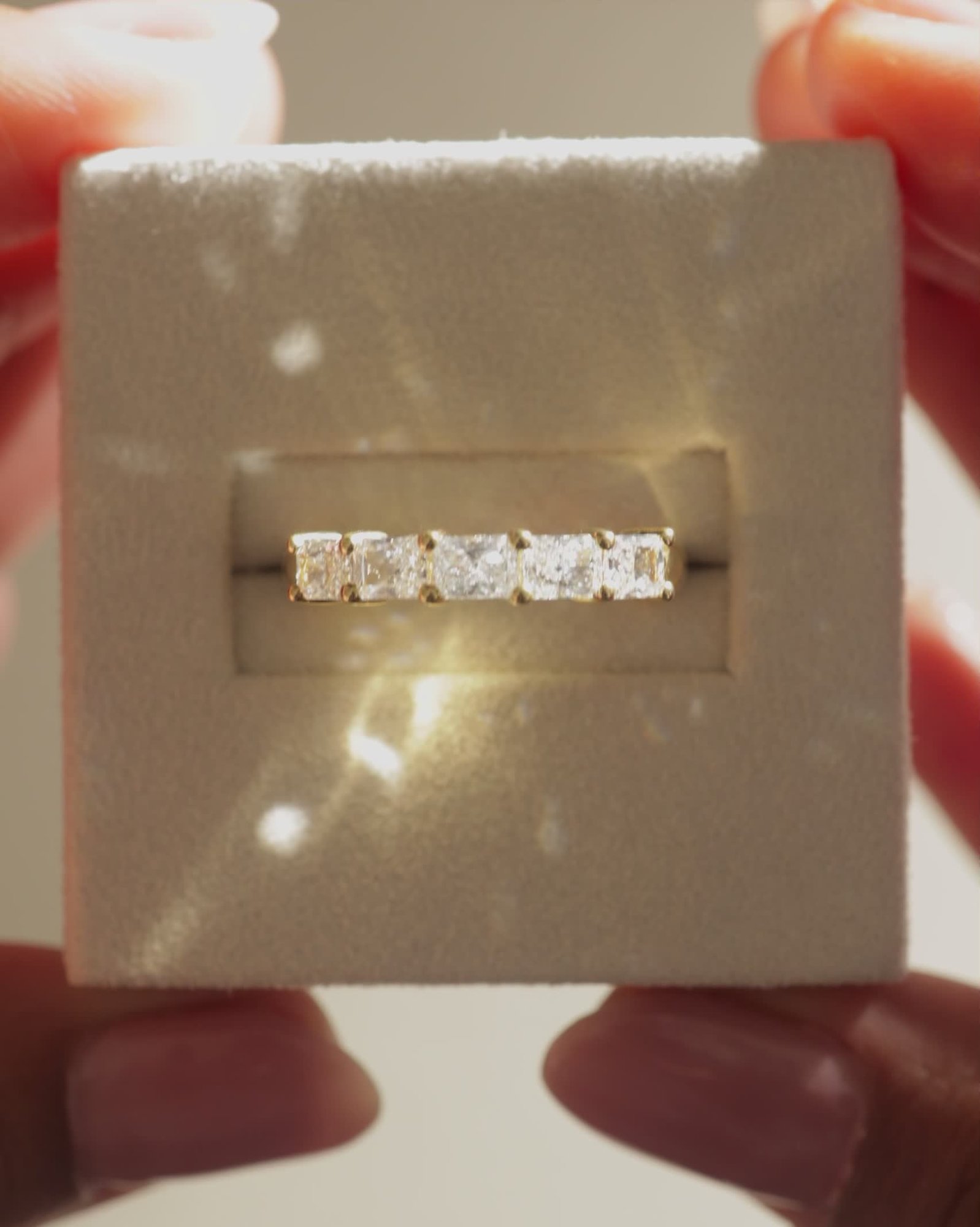 Maia - 5 Stone East West Radiant Wedding Band Lifestyle Image