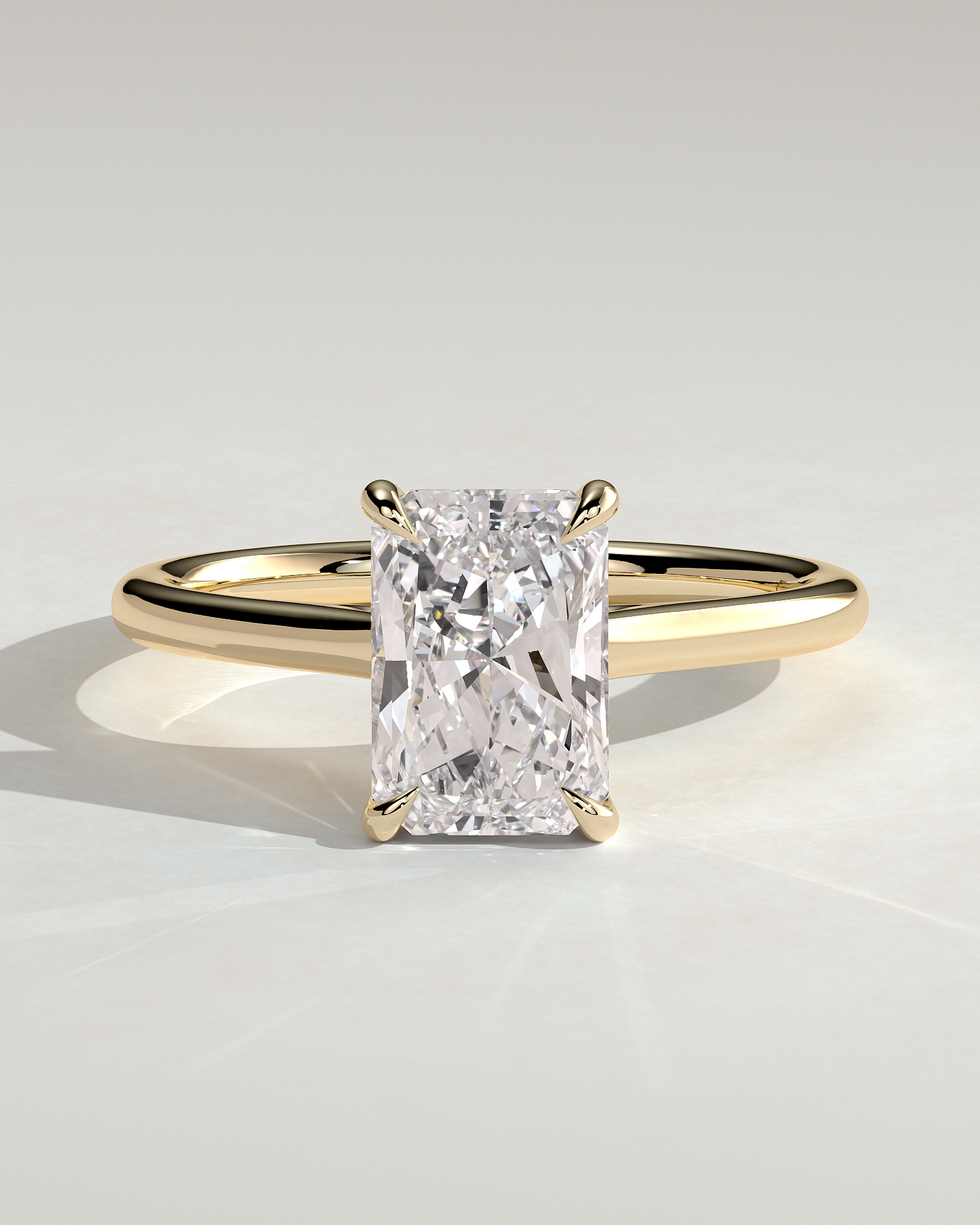 Jane - Emerald Solitaire with Hidden Halo and Cathedral Setting - 18k Yellow Gold
