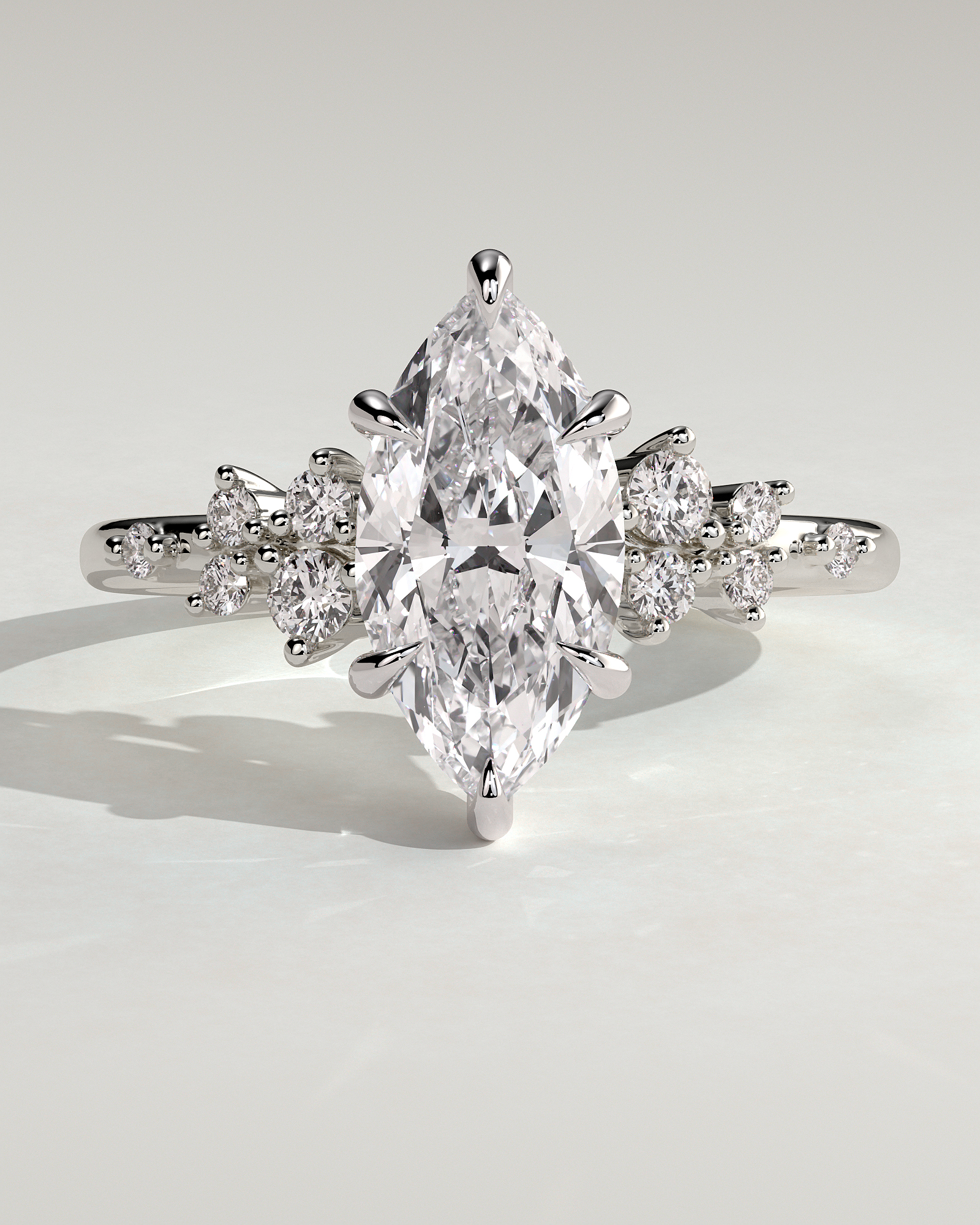 Minnie - Marquise Solitaire with Clustered Round Accent Stones - 18k White Gold