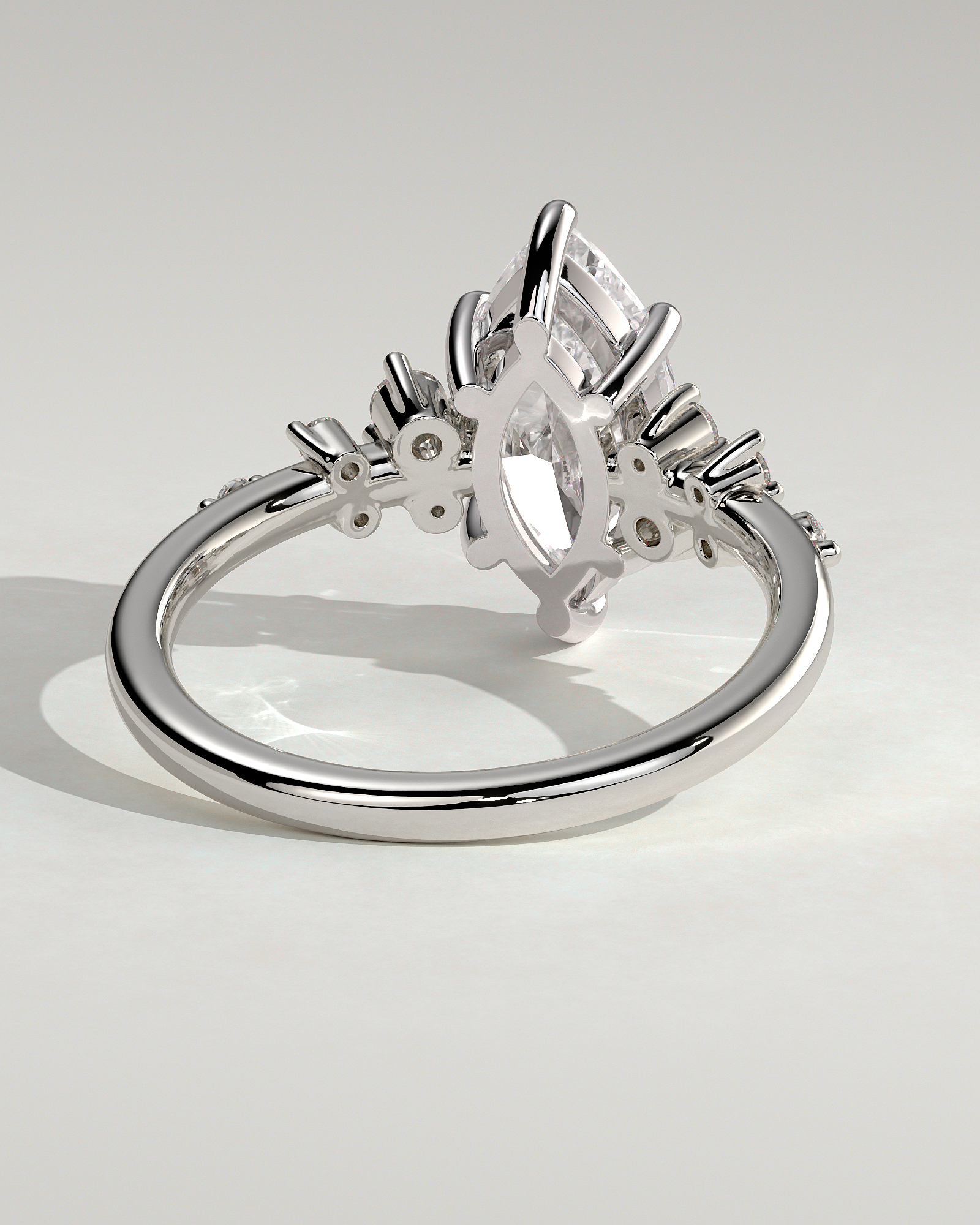 Minnie - Marquise Solitaire with Clustered Round Accent Stones - 18k White Gold