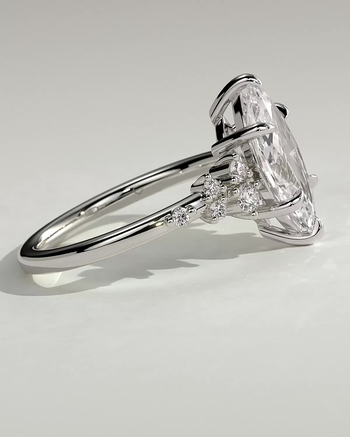 Minnie - Marquise Solitaire with Clustered Round Accent Stones - 18k White Gold