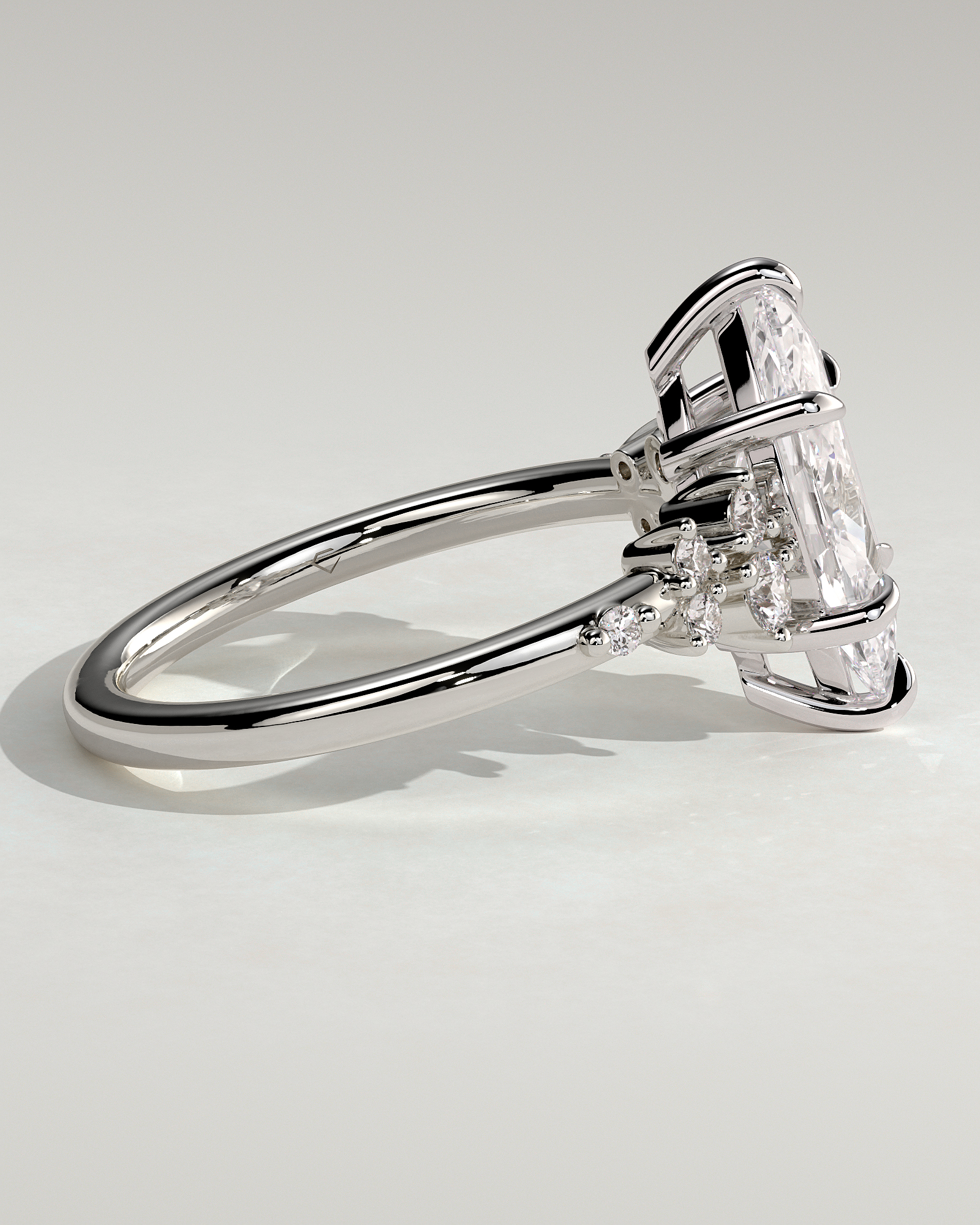 Minnie - Marquise Solitaire with Clustered Round Accent Stones - 18k White Gold