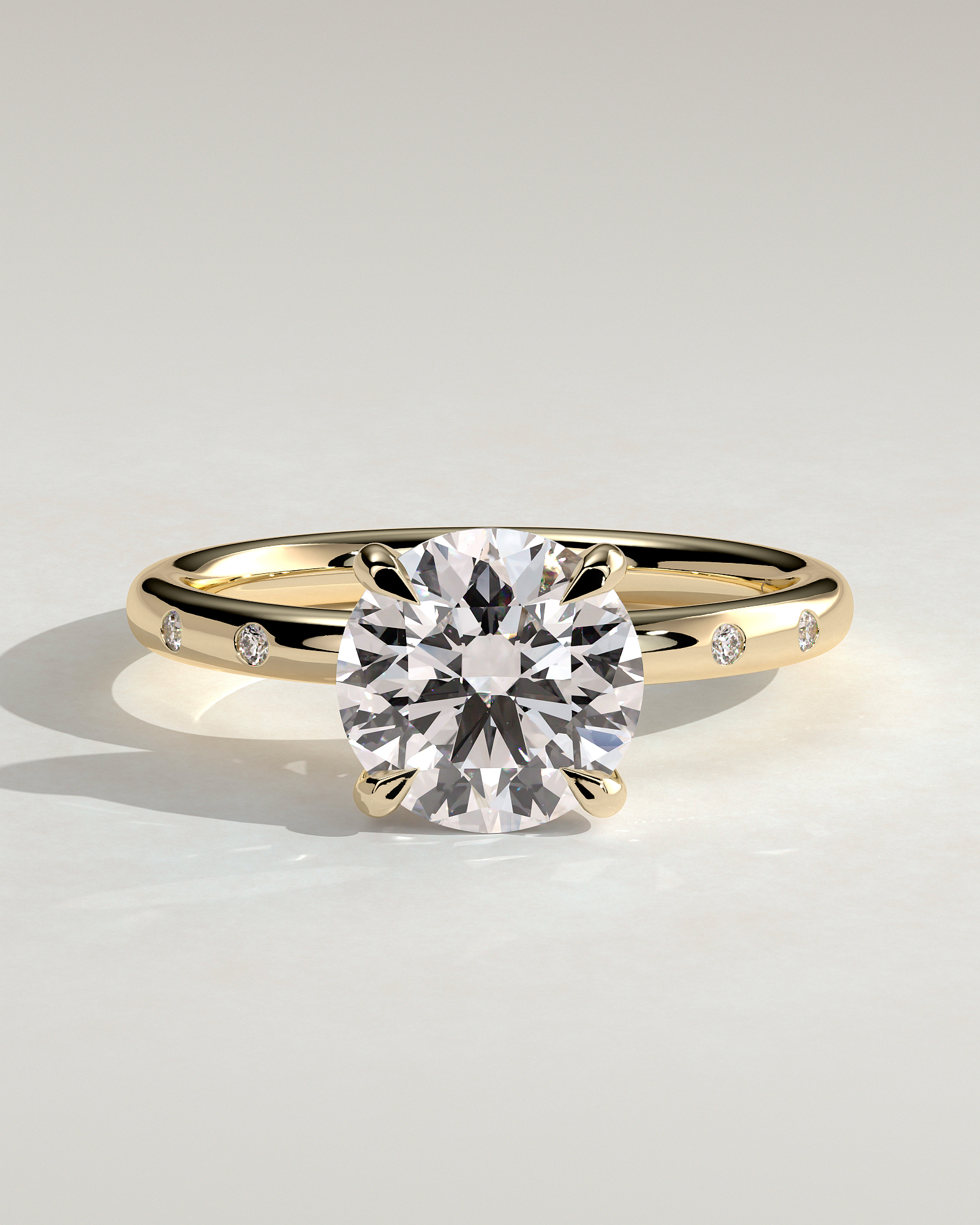 Nekija - 4 Claw Round Solitaire with Accent Stones - 18k Yellow Gold