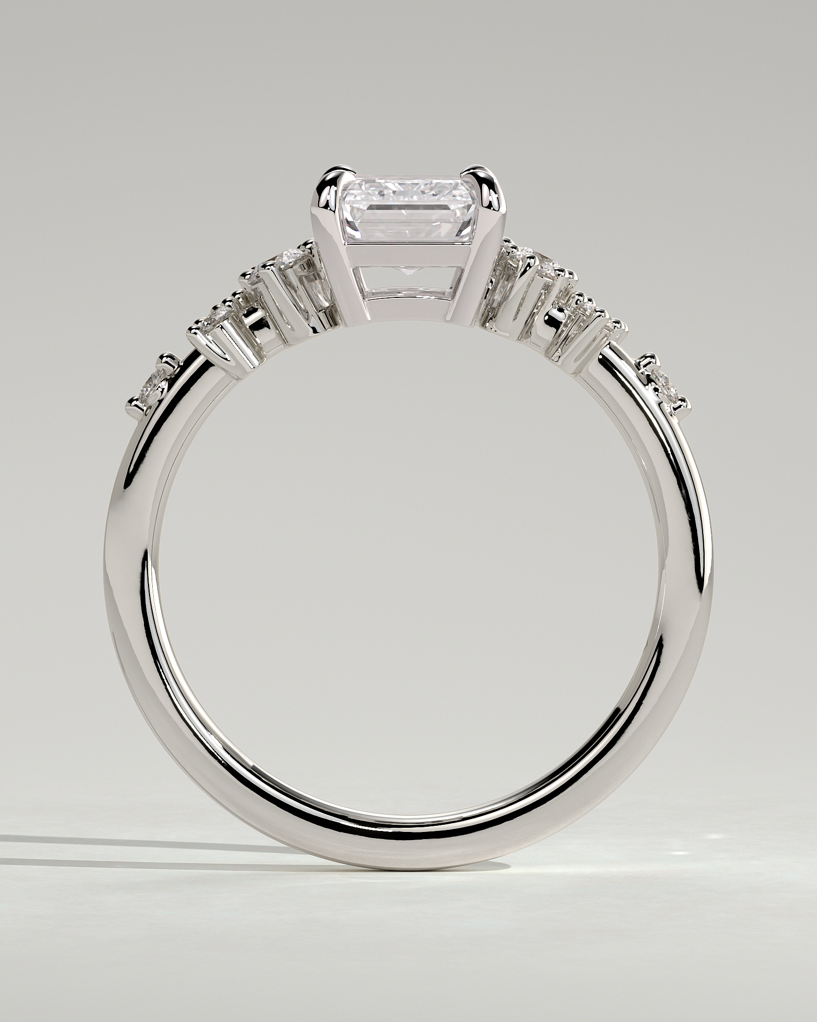 Nellie - Emerald Solitaire with Clustered Round Accent Stones - 18k White Gold