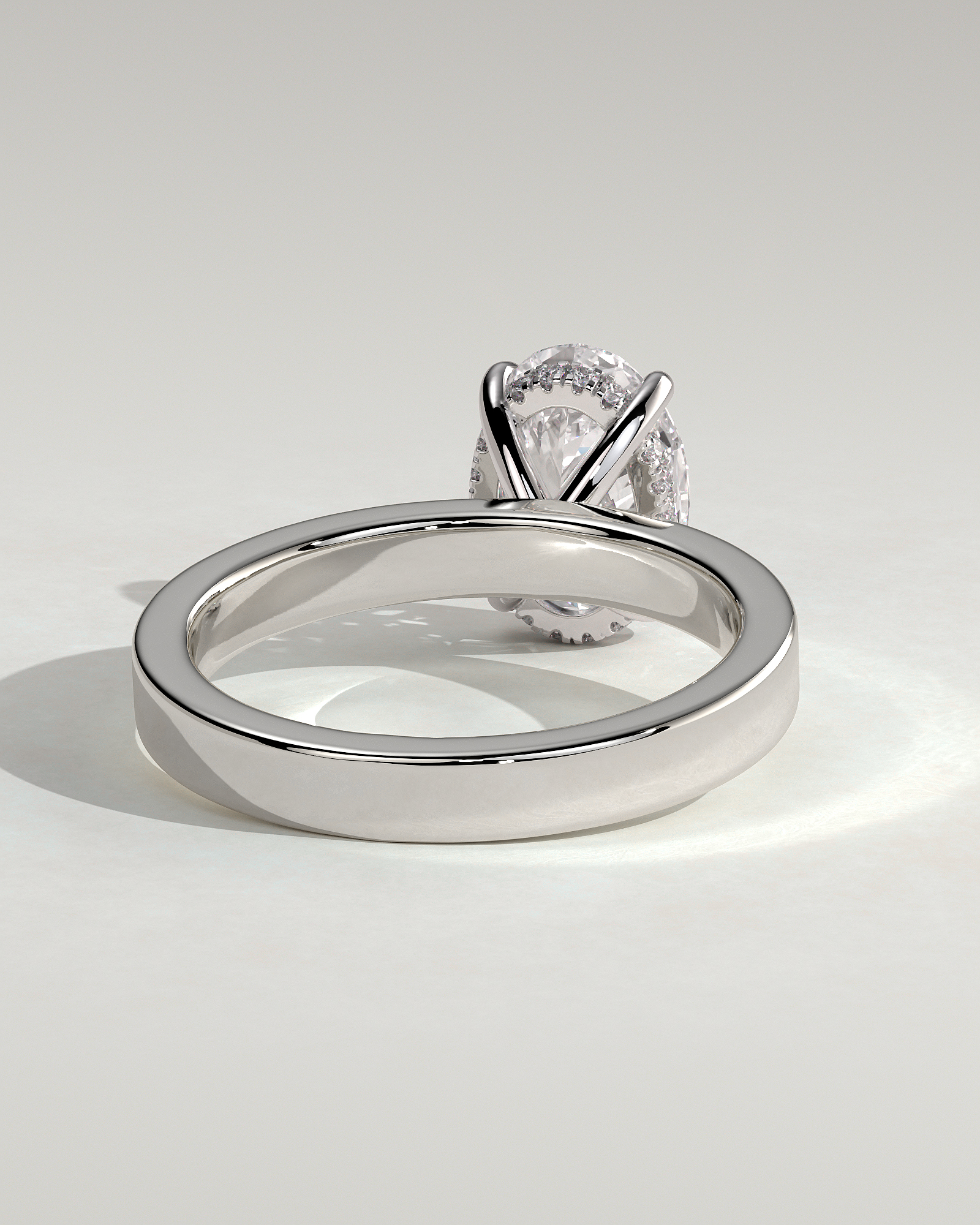 Nikita - Oval 4 Claw Solitaire with Flat Cigar Band and Hidden Halo Engagement Ring - 18k White Gold High Setting