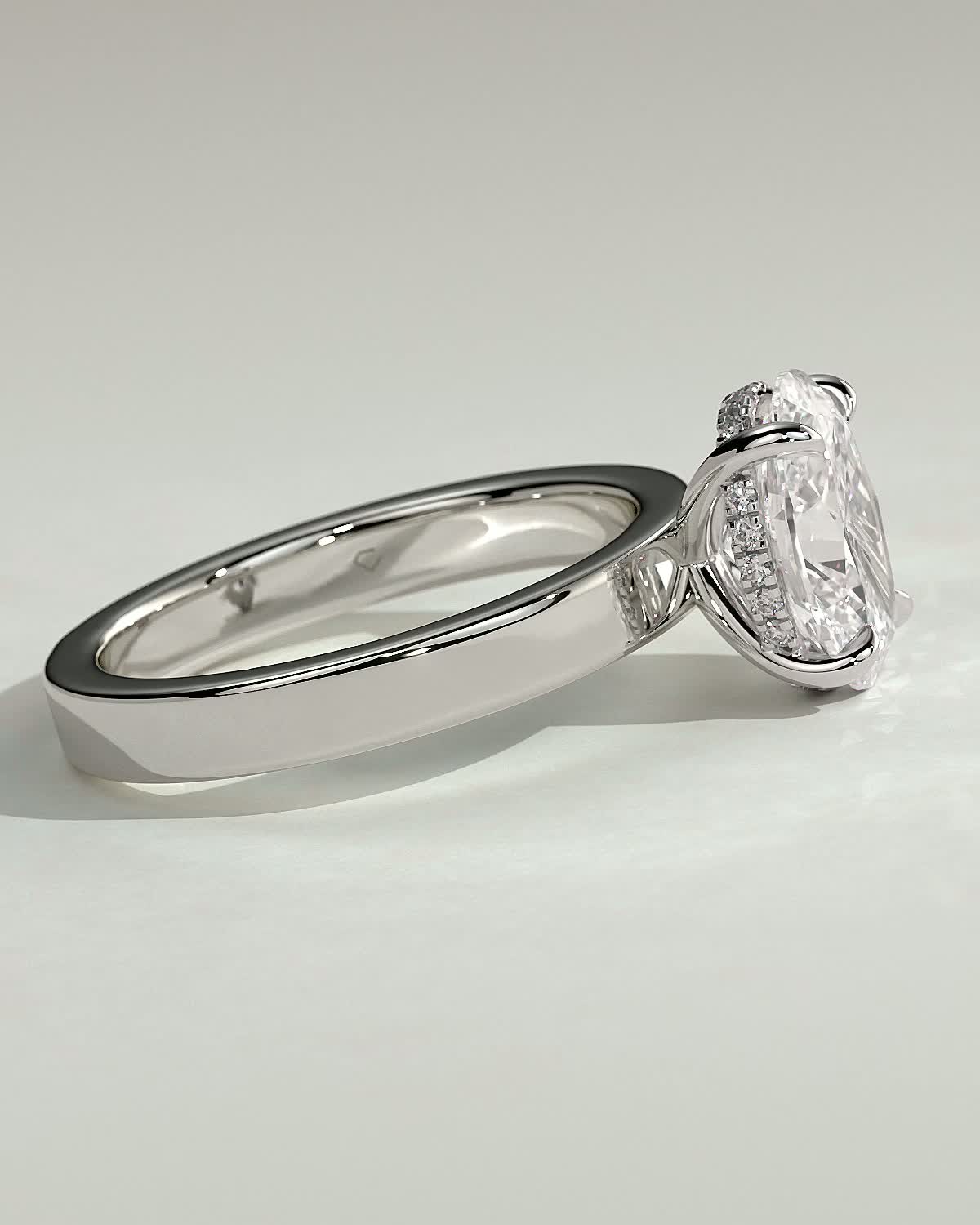 Nikita - Oval 4 Claw Solitaire with Flat Cigar Band and Hidden Halo Engagement Ring - 18k White Gold High Setting