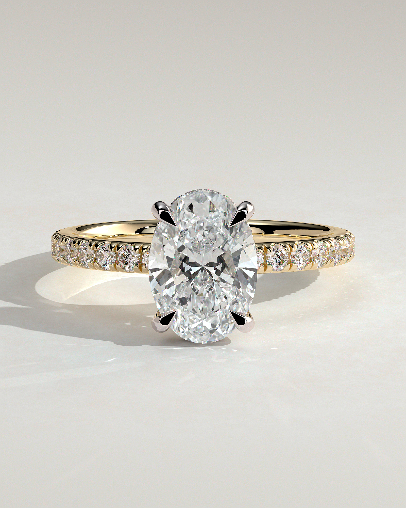 Paige - Oval 4 Claw Solitaire with Hidden Halo and Pave Band Engagement Ring - 18k Yellow Gold / 18k White Gold