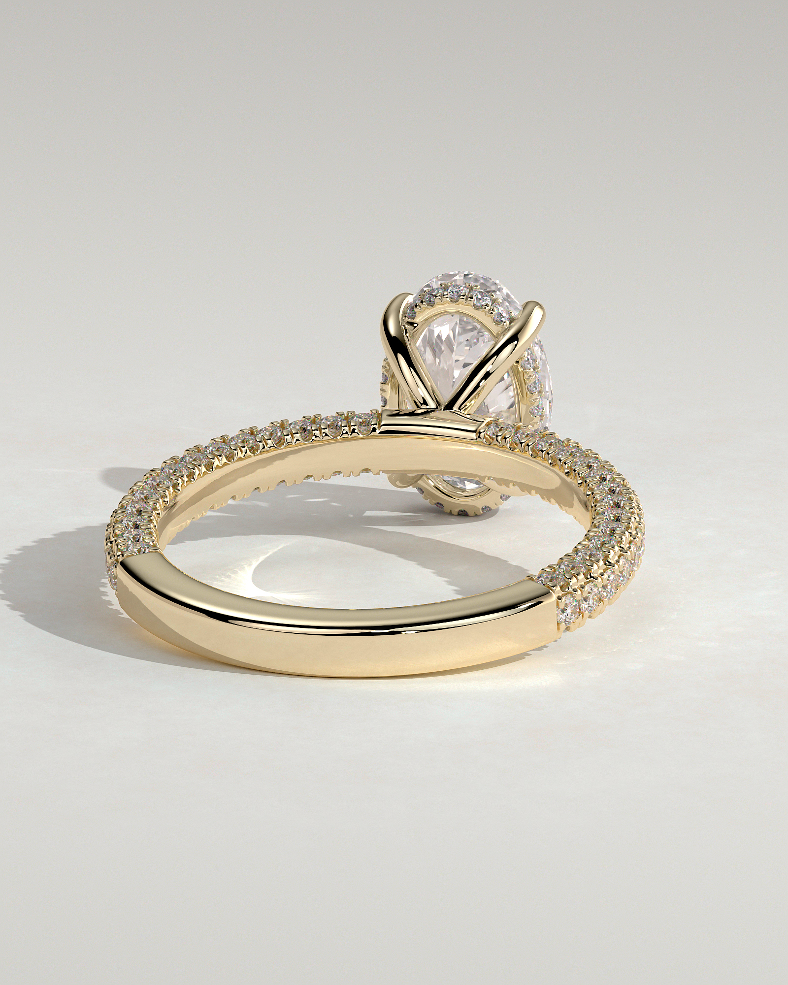 Penelope   Oval Solitaire with Hidden Halo and Triple Pav - 18k Yellow Gold