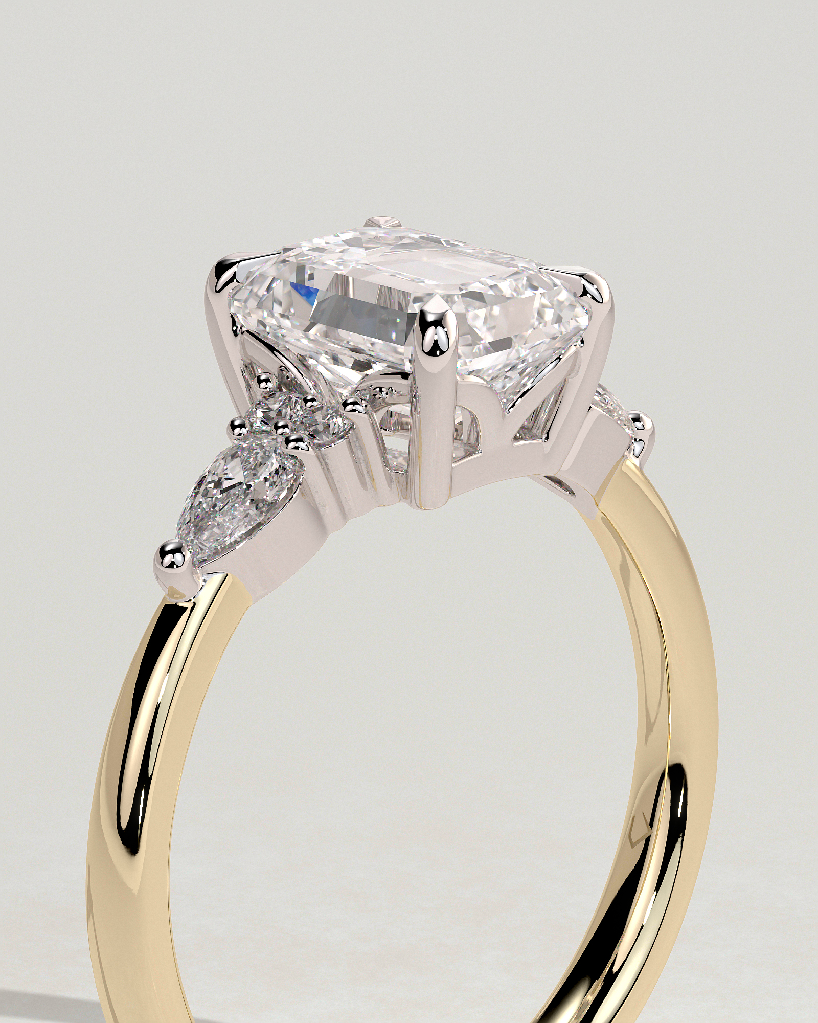 Raleigh - Emerald 4 Claw Solitaire with Pear Accents and Round Shoulder Stones Engagement Ring - 18k Yellow Gold / 18k White Gold