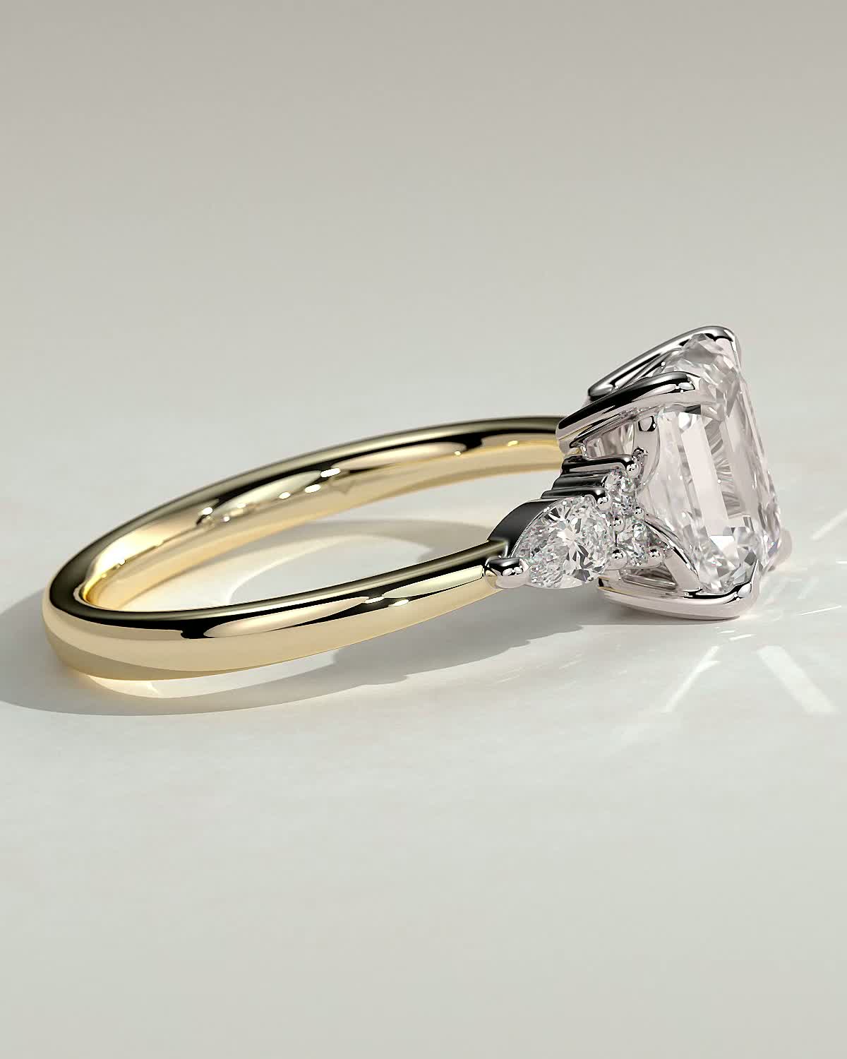 Raleigh - Emerald 4 Claw Solitaire with Pear Accents and Round Shoulder Stones Engagement Ring - 18k Yellow Gold / 18k White Gold