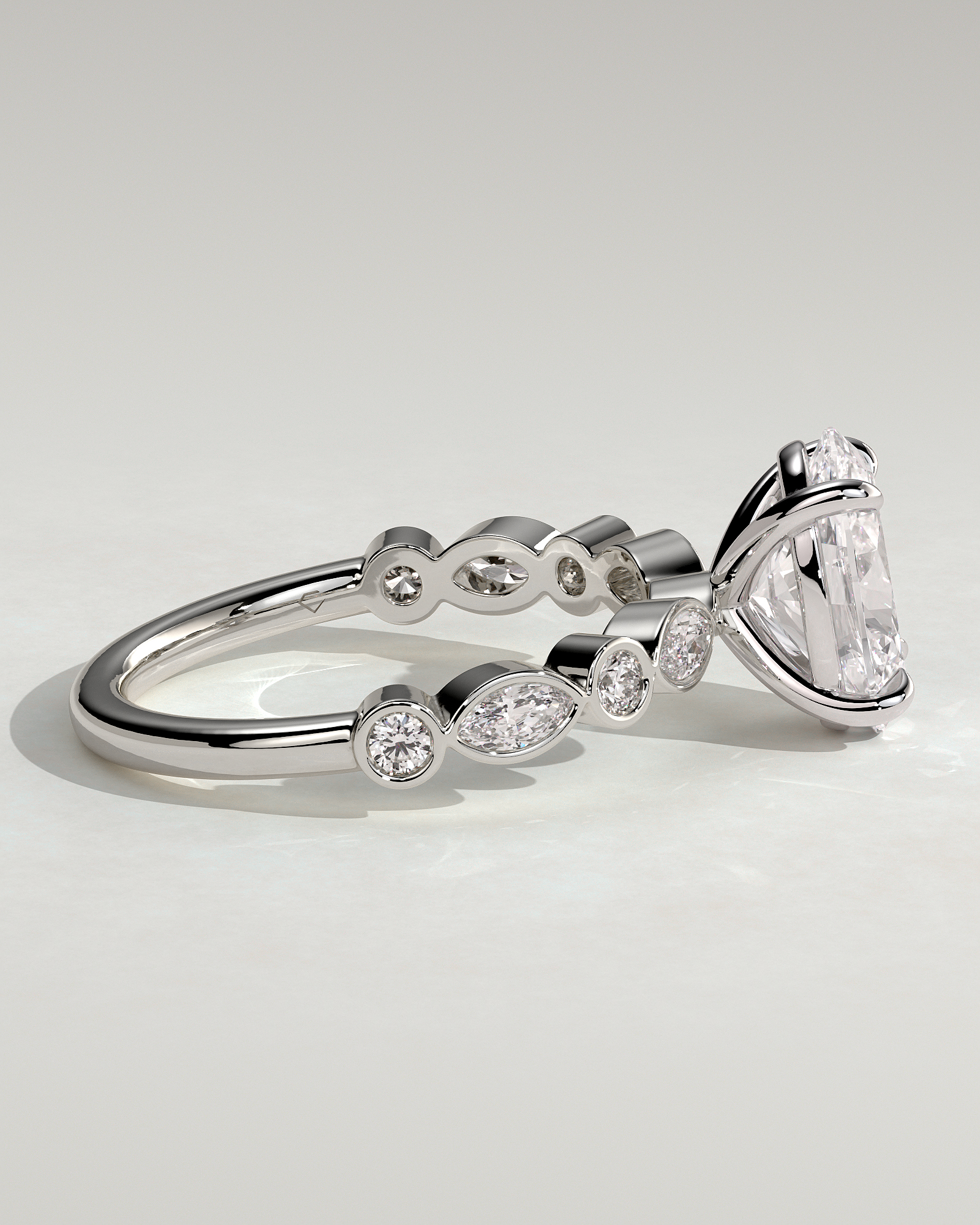 Rhiannon - Oval Solitaire with Bezel Set Accent Stones - 18k White Gold