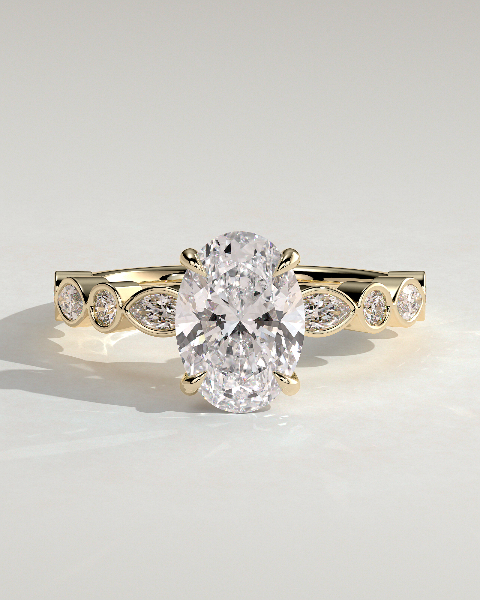 Rhiannon - Oval Solitaire with Bezel Set Accent Stones - 18k Yellow Gold