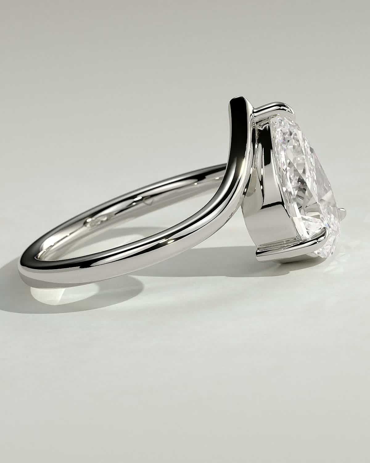 Riley - Pear Solitaire with Curved Band - 18k White Gold
