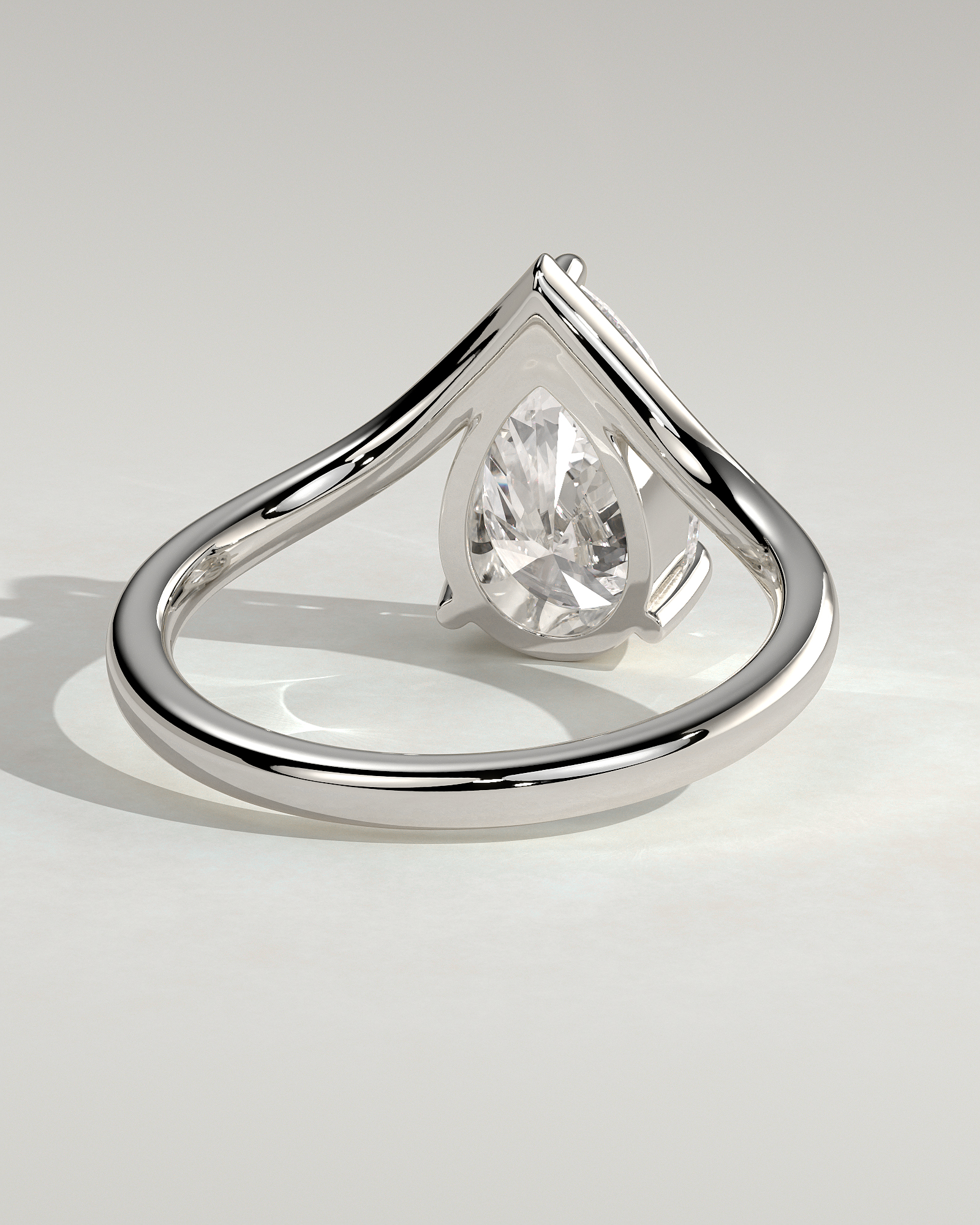 Riley - Pear Solitaire with Curved Band - 18k White Gold