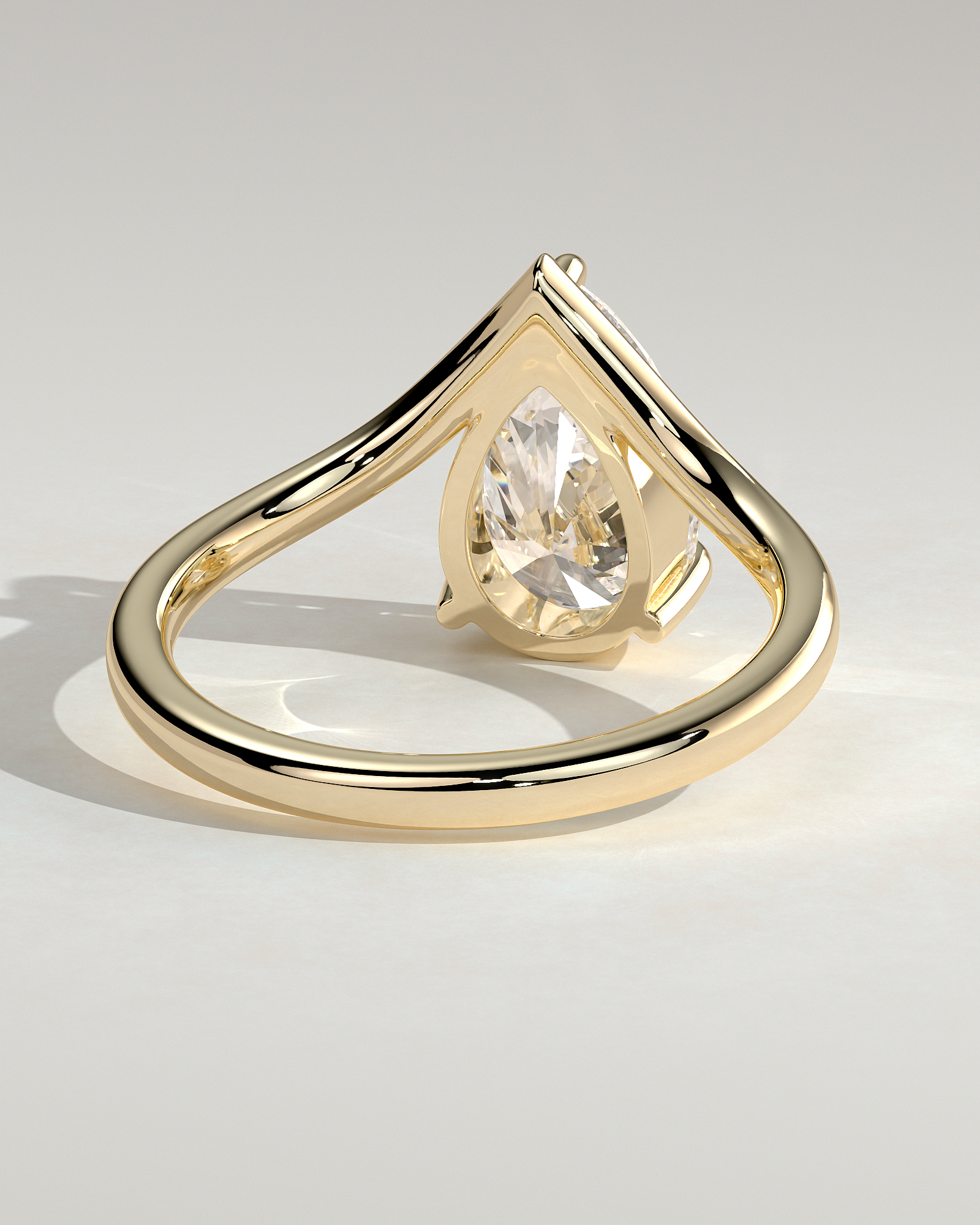 Riley - Pear Solitaire with Curved Band - 18k Yellow Gold