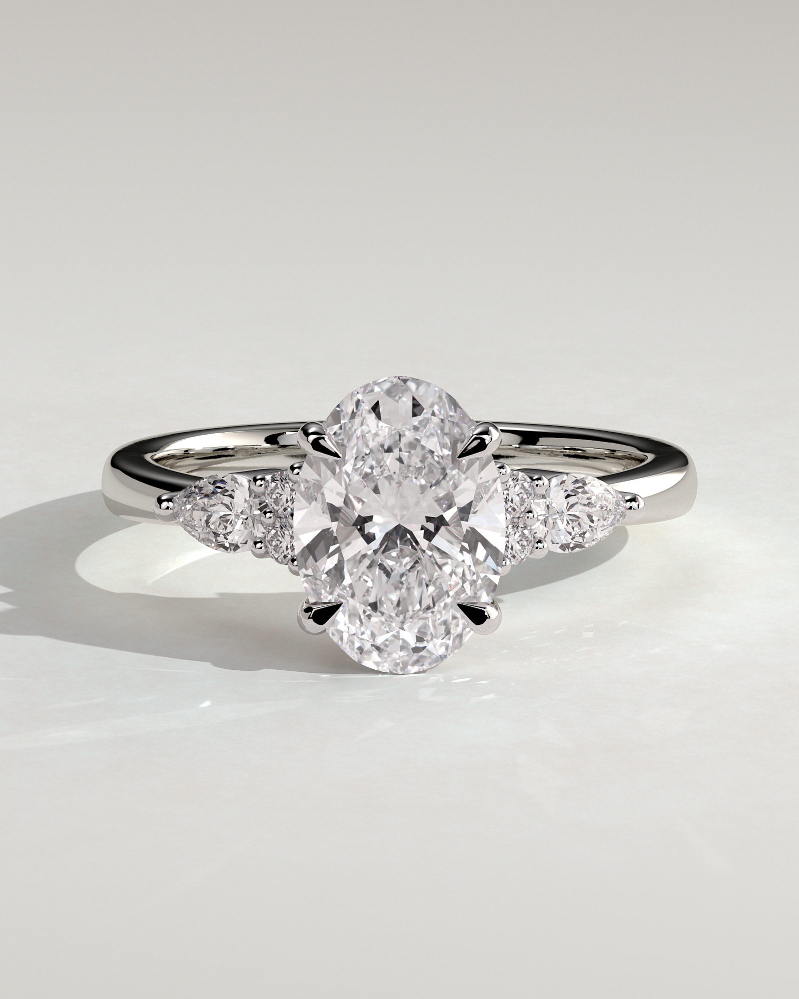 Sheridan  Oval Trilogy with Round and Pear Stones - 18k White Gold High Setting