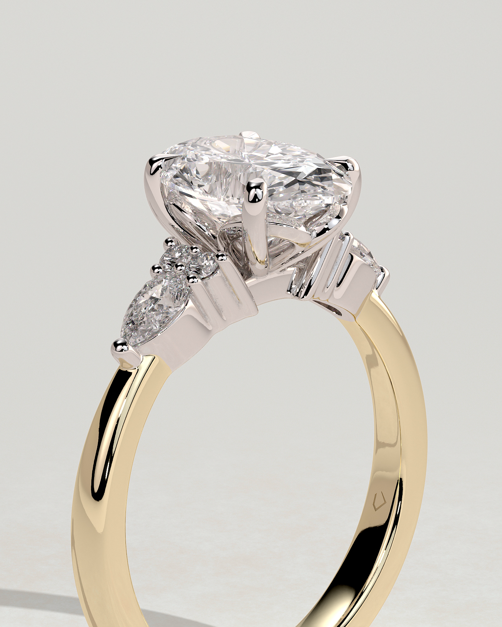 Sheridan  Oval Trilogy with Round and Pear Stones - 18k Yellow Gold / 18k White Gold High Setting