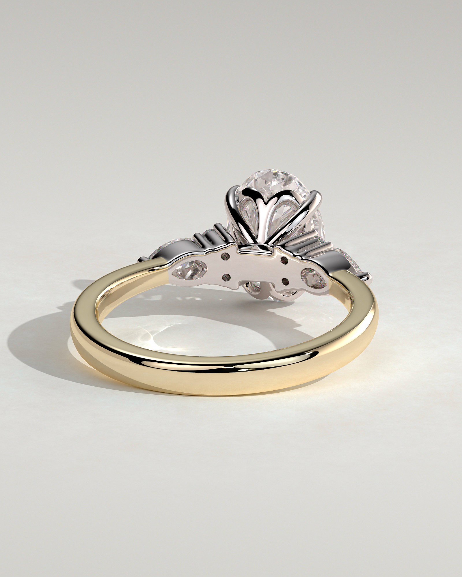 Sheridan  Oval Trilogy with Round and Pear Stones - 18k Yellow Gold / 18k White Gold High Setting