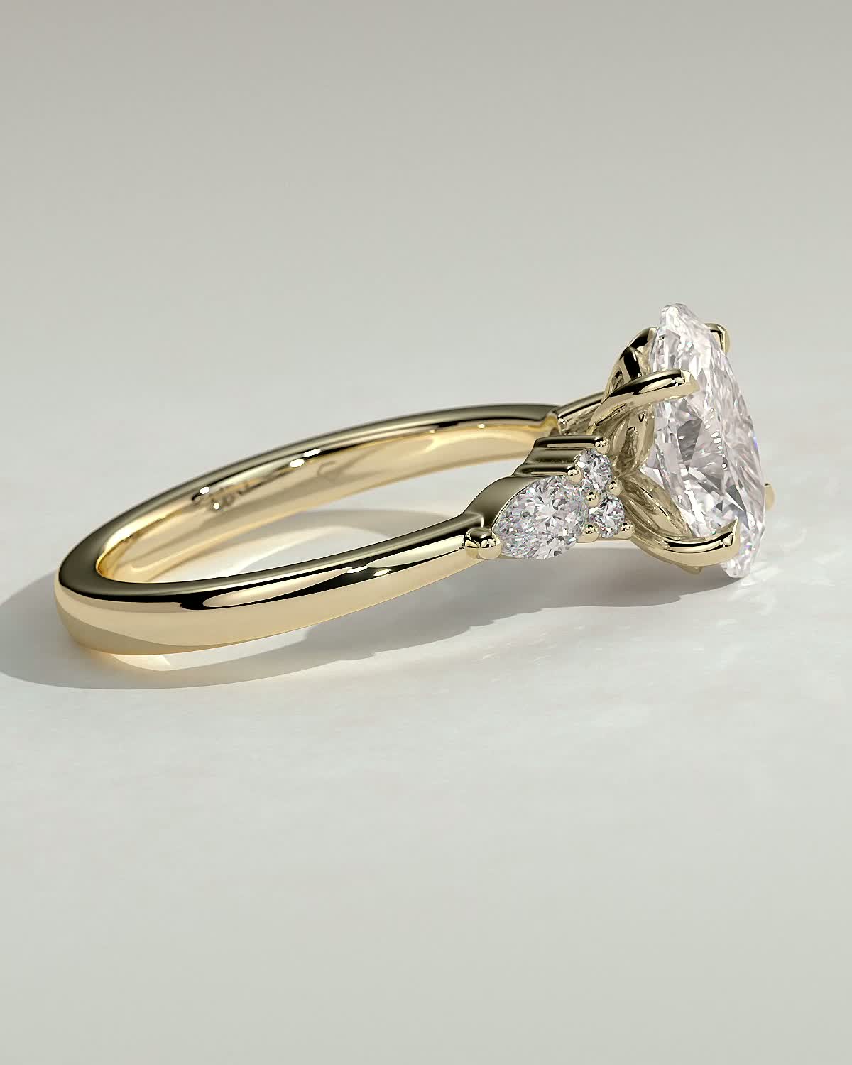 Sheridan  Oval Trilogy with Round and Pear Stones - 18k Yellow Gold High Setting