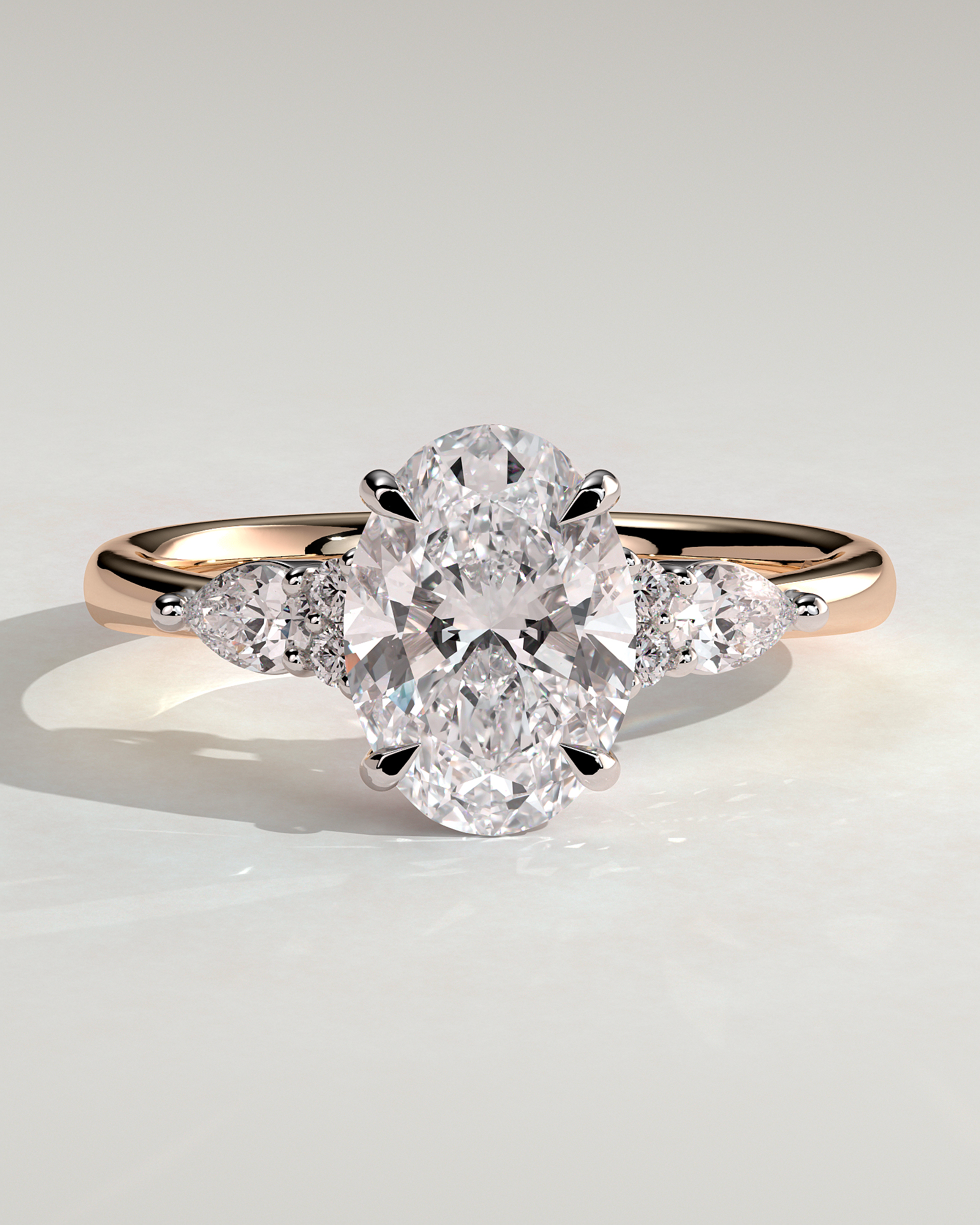 Sheridan  Oval Trilogy with Round and Pear Stones - 18k Rose Gold / 18k White Gold Low Setting