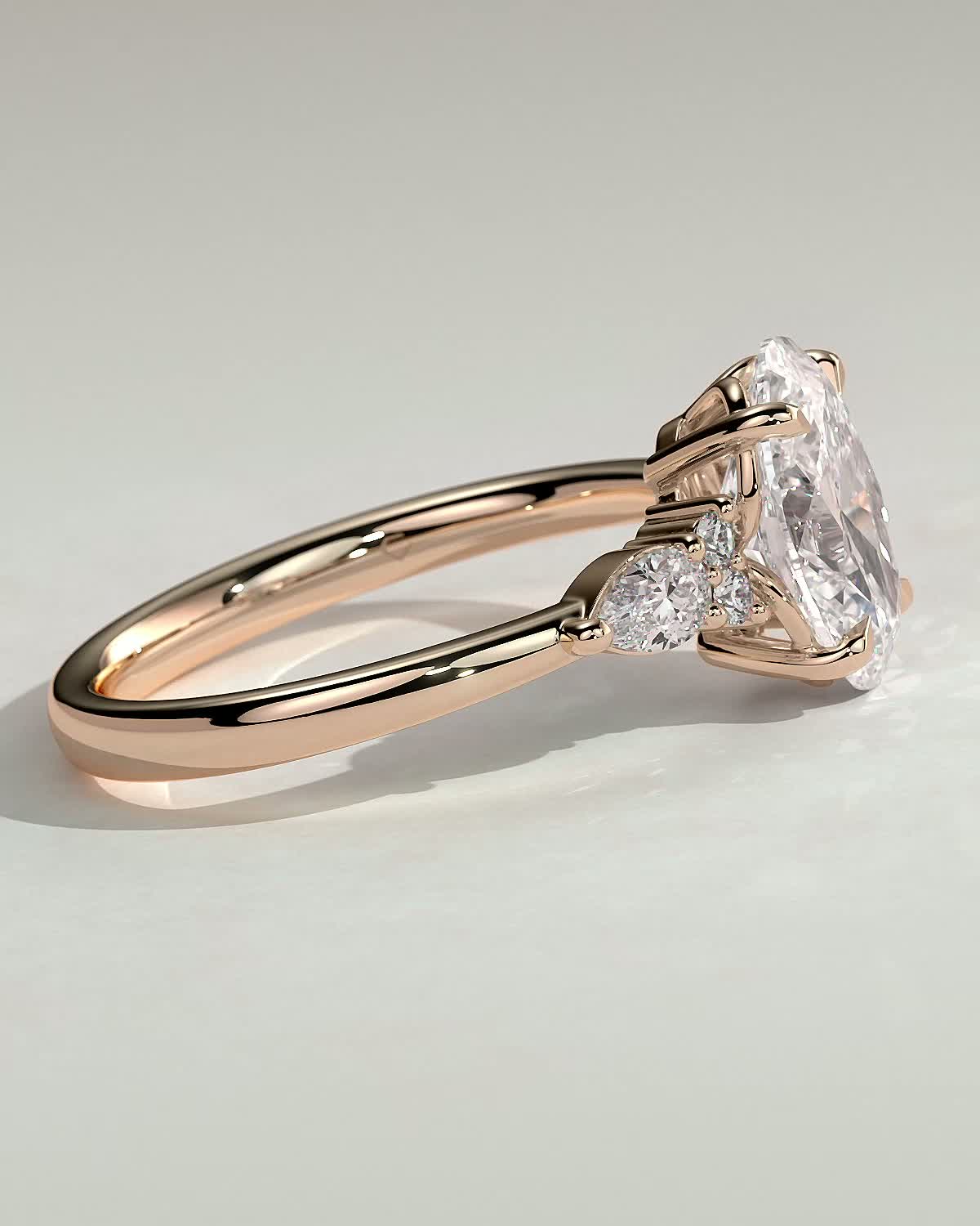 Sheridan  Oval Trilogy with Round and Pear Stones - 18k Rose Gold Low Setting