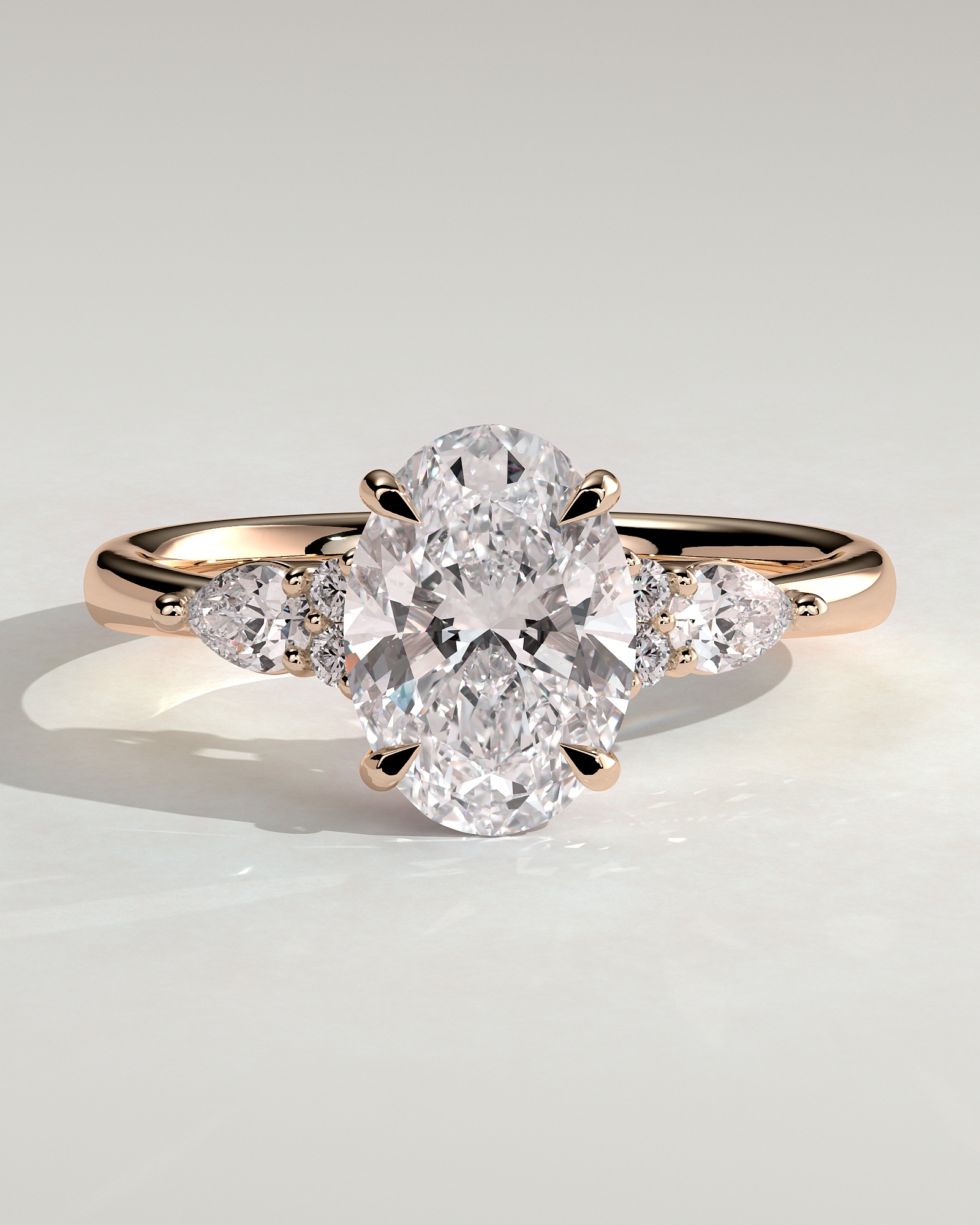 Sheridan  Oval Trilogy with Round and Pear Stones - 18k Rose Gold Low Setting