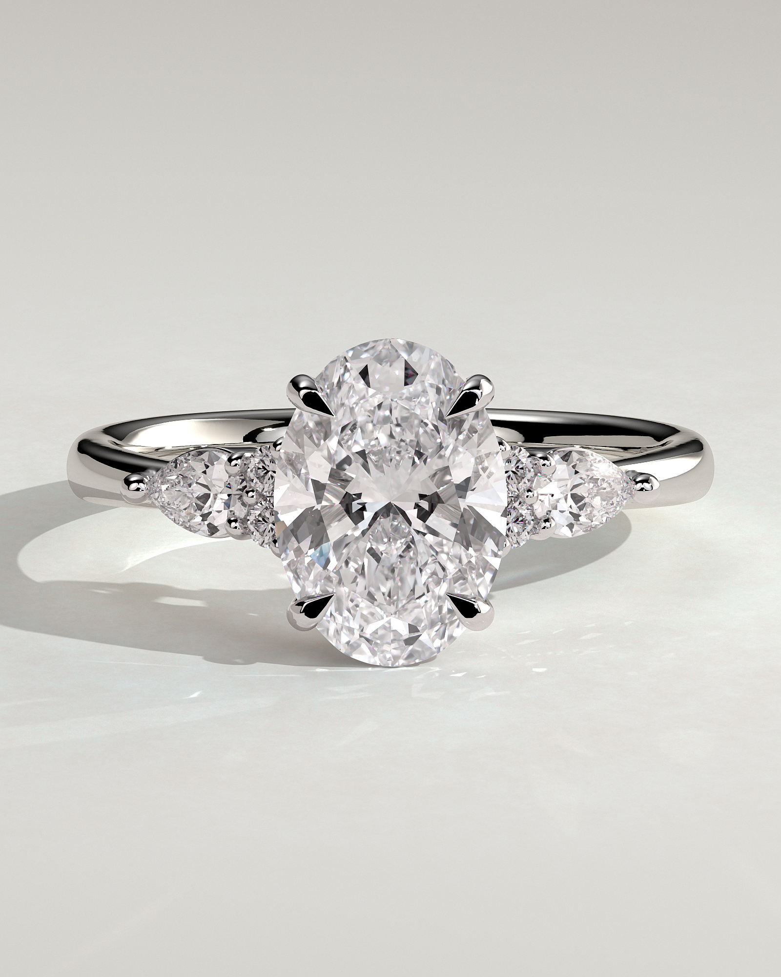 Sheridan - Oval 4 Claw Solitaire with Pear Accents and Round Shoulder Stones Engagement Ring - 18k White Gold Low Setting