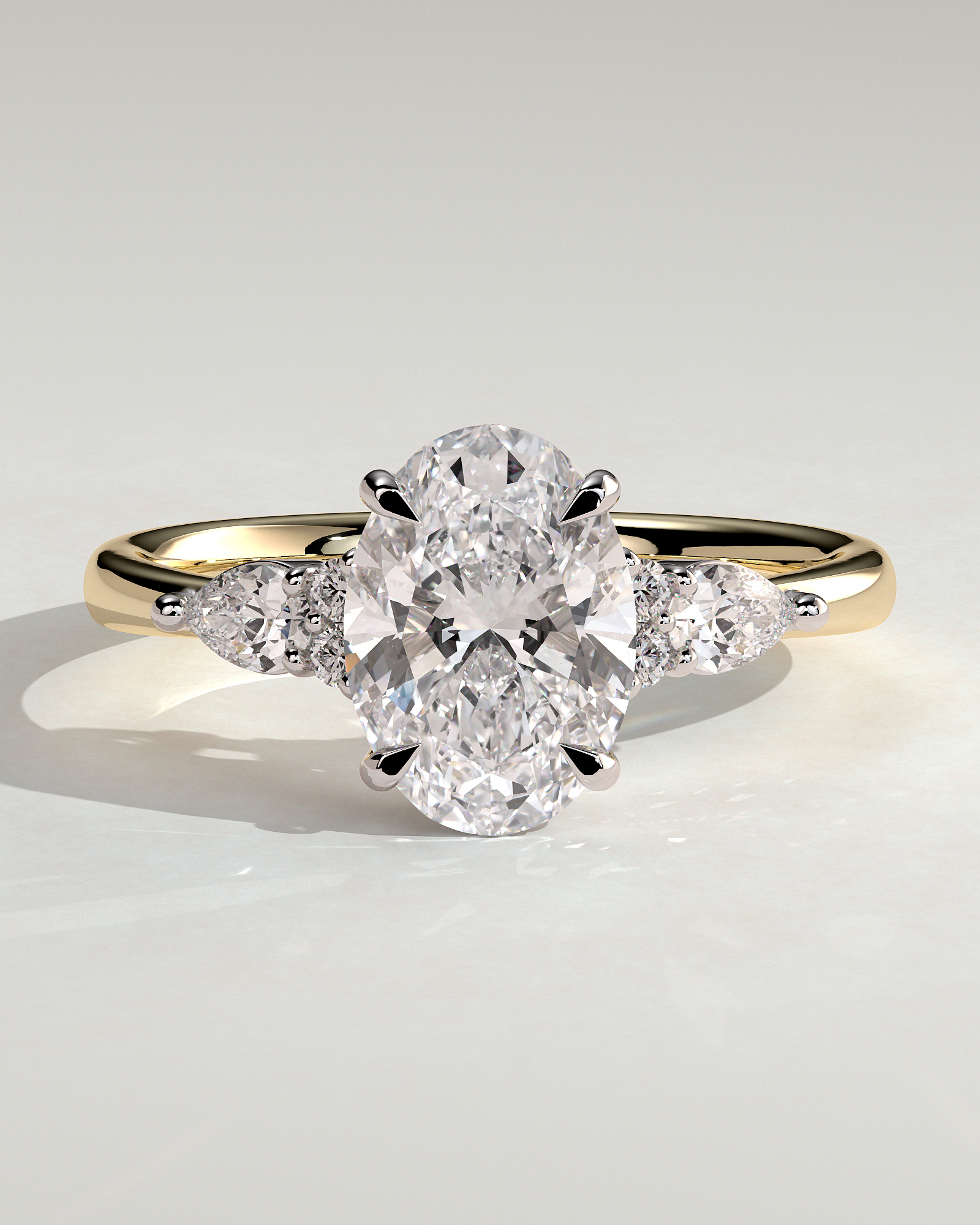 Sheridan - Oval 4 Claw Solitaire with Pear Accents and Round Shoulder Stones Engagement Ring - 18k Yellow Gold / 18k White Gold Low Setting