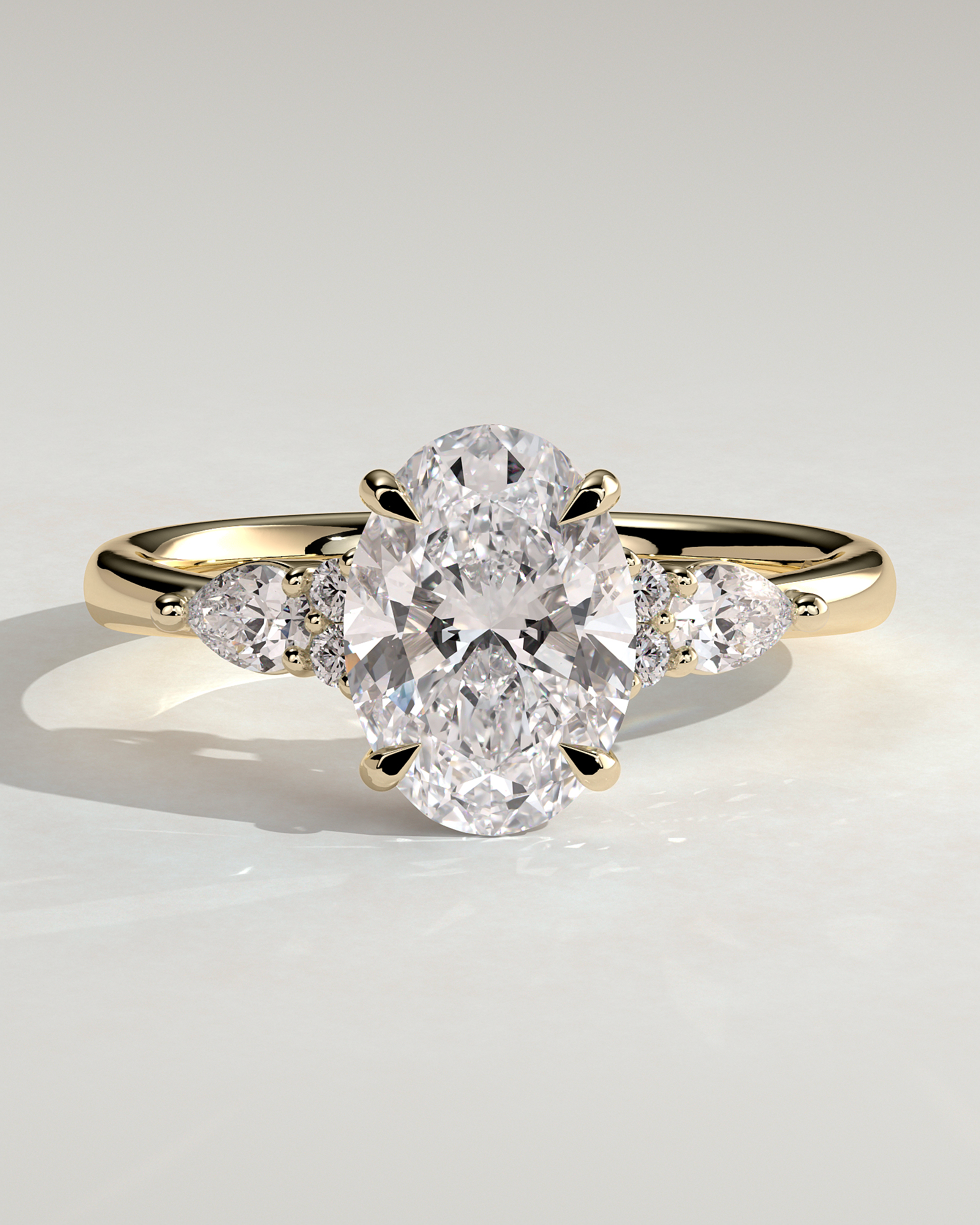 Sheridan - Oval 4 Claw Solitaire with Pear Accents and Round Shoulder Stones Engagement Ring - 18k Yellow Gold Low Setting