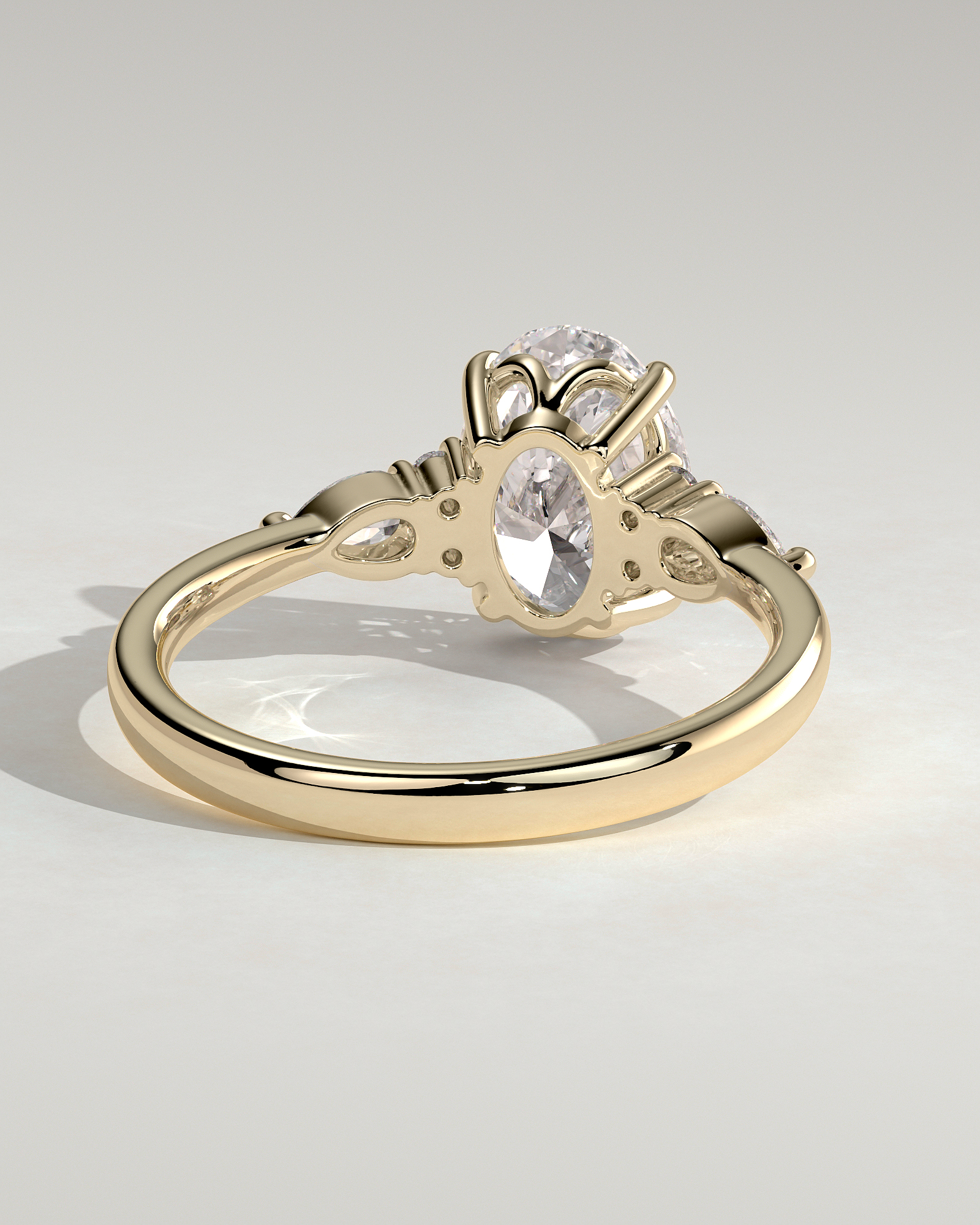 Sheridan - Oval 4 Claw Solitaire with Pear Accents and Round Shoulder Stones Engagement Ring - 18k Yellow Gold Low Setting