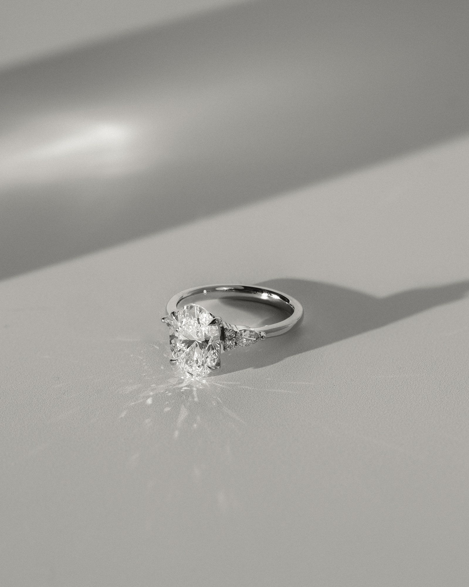 Sheridan  Oval Trilogy with Round and Pear Stones Lifestyle Image